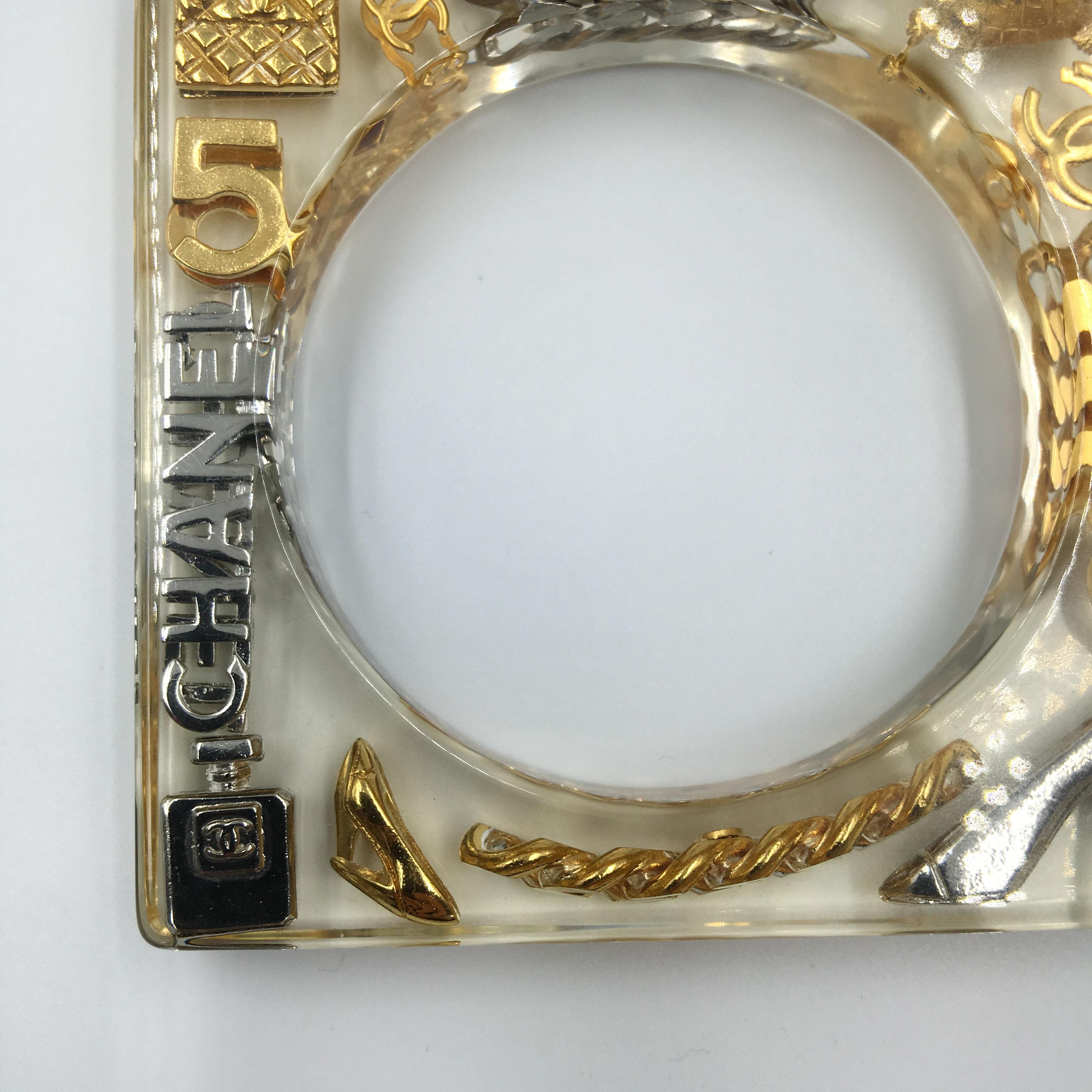 Chanel Square Lucite Bangle with Gold and Silver Inlaid Charms In Good Condition In Los Angeles, CA
