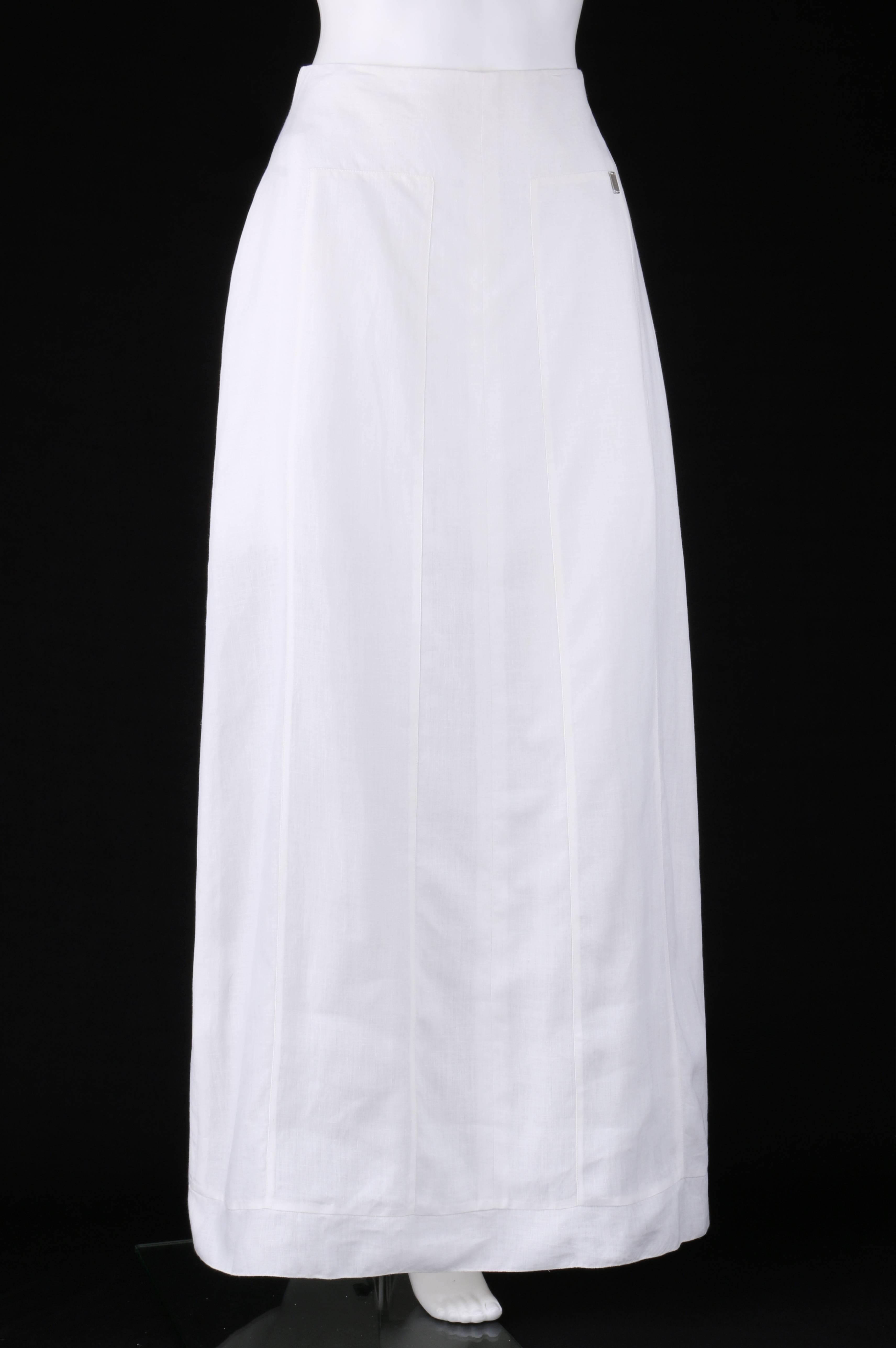 Chanel Spring/Summer 1999 white linen floor length classic maxi skirt; New with tags. Designed by Karl Lagerfeld. Floor length. Maxi style. High waisted. Two inset oblong panels at front and back from hips to hem. 