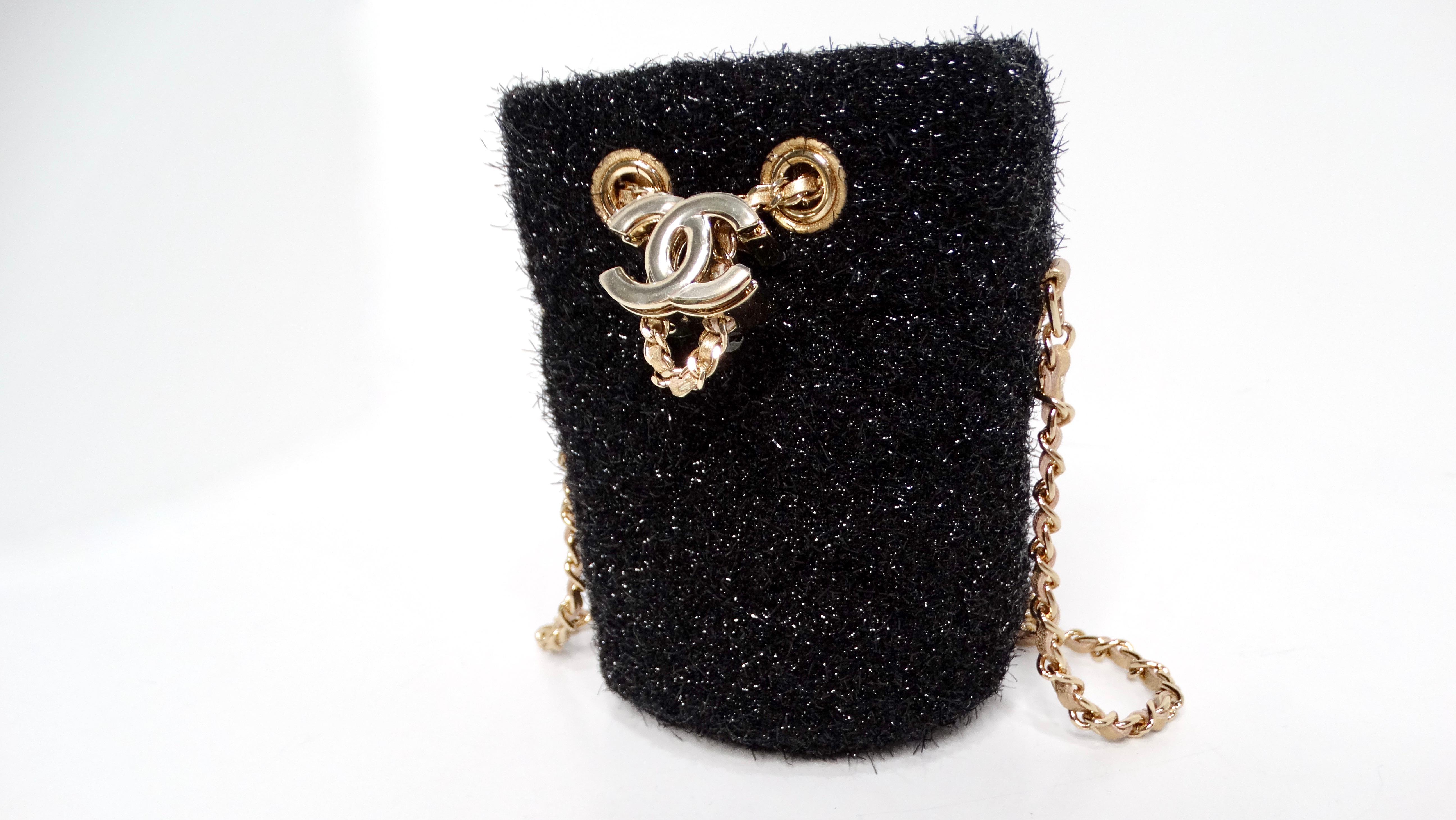 Introducing the stunning Chanel SS-2022 Haute Couture Black Lurex Tweed Mini Bucket Crossbody Bag, a show-stopping piece that captures the magic of the Spring/Summer 2022 Haute Couture collection. Crafted from luxurious black lurex, this mini bag