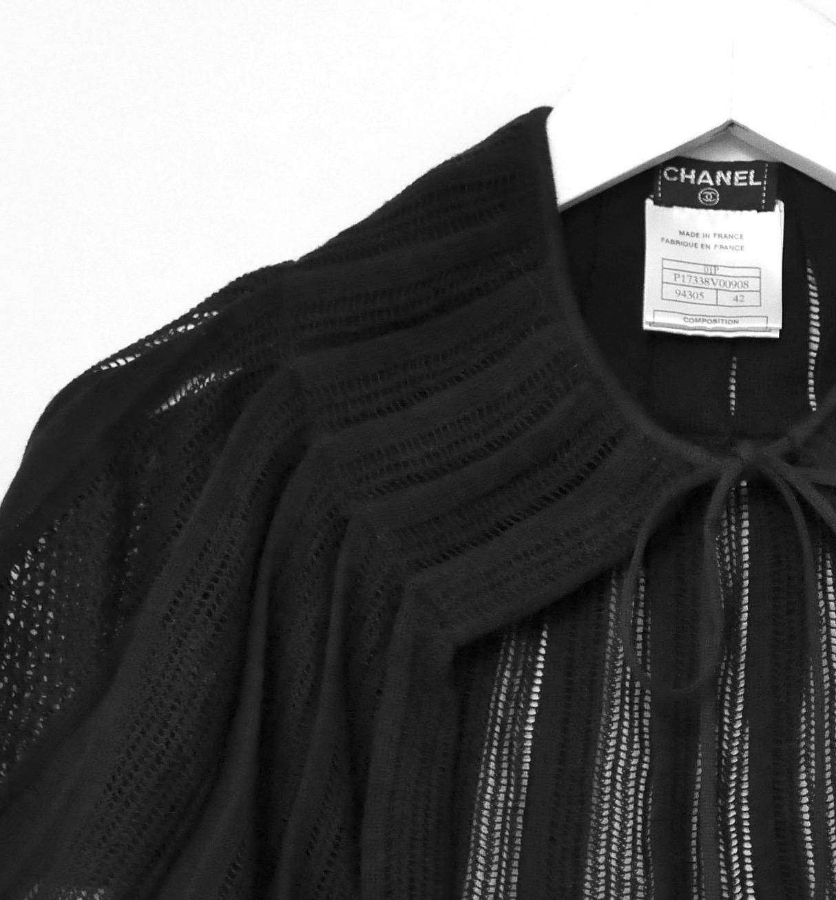 Super cool, futuristic Chanel black jacket from the Spring 2012 collection. Unworn. 

Made from mid weight black polyester mesh with satin trims. It has working black zips to the shoulders, zip pockets and zip front with double fob. All fobs are CC