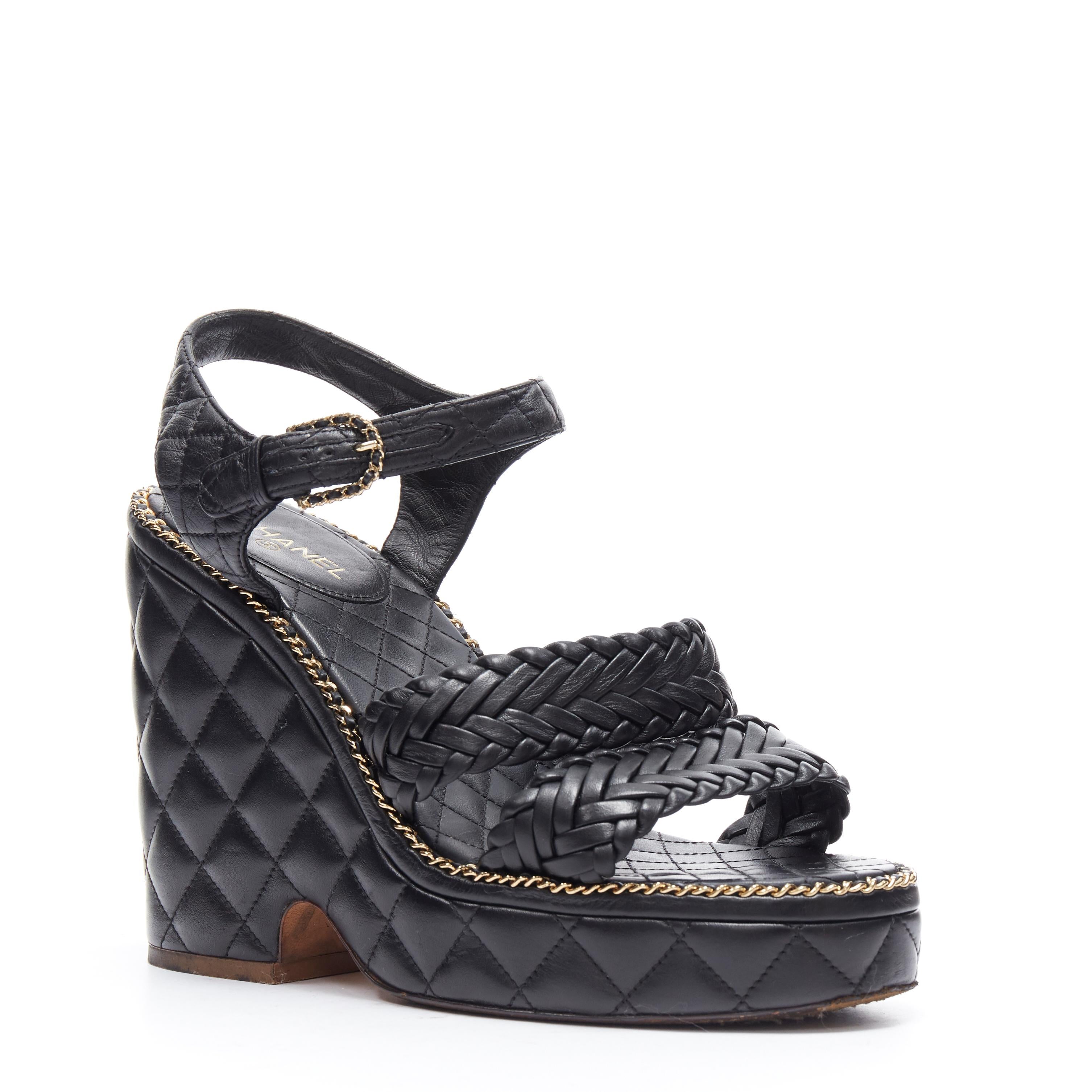 CHANEL SS15 black braided leather 2.55 chain diamond quilted wedge sandal EU39 
Reference: TGAS/A03452 
Brand: Chanel 
Designer: Karl Lagerfeld 
Model: Wedge 
Collection: Spring Summer 2015 Runway 
Material: Leather 
Color: Black 
Pattern: Solid