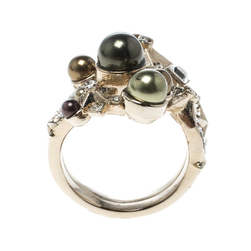This beautiful Star Comet ring from Chanel with shimmery crystals and a faux pearl on the centre is glamorous and lovely for everyday use or for a special occasion. The fashionable ring is stunning, and its rich, feminine appeal blends well with