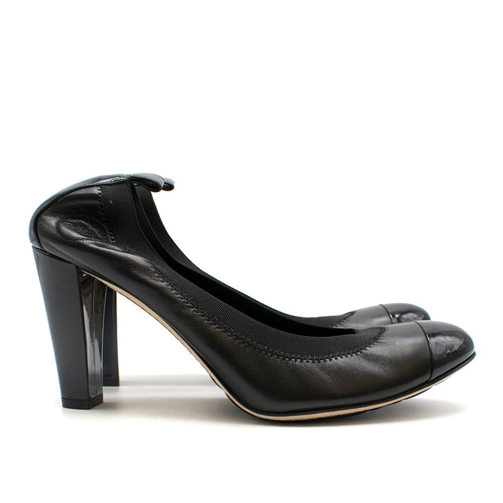 Chanel Stretch Spirit pumps. Tonal patent leather cap toes, 
with the embroidered interlocking CC at both sides. Elasticized trim and covered, shiny block heels matching the cap toes. 

- Made in Italy
- No signs of being worn
- Dust-bag