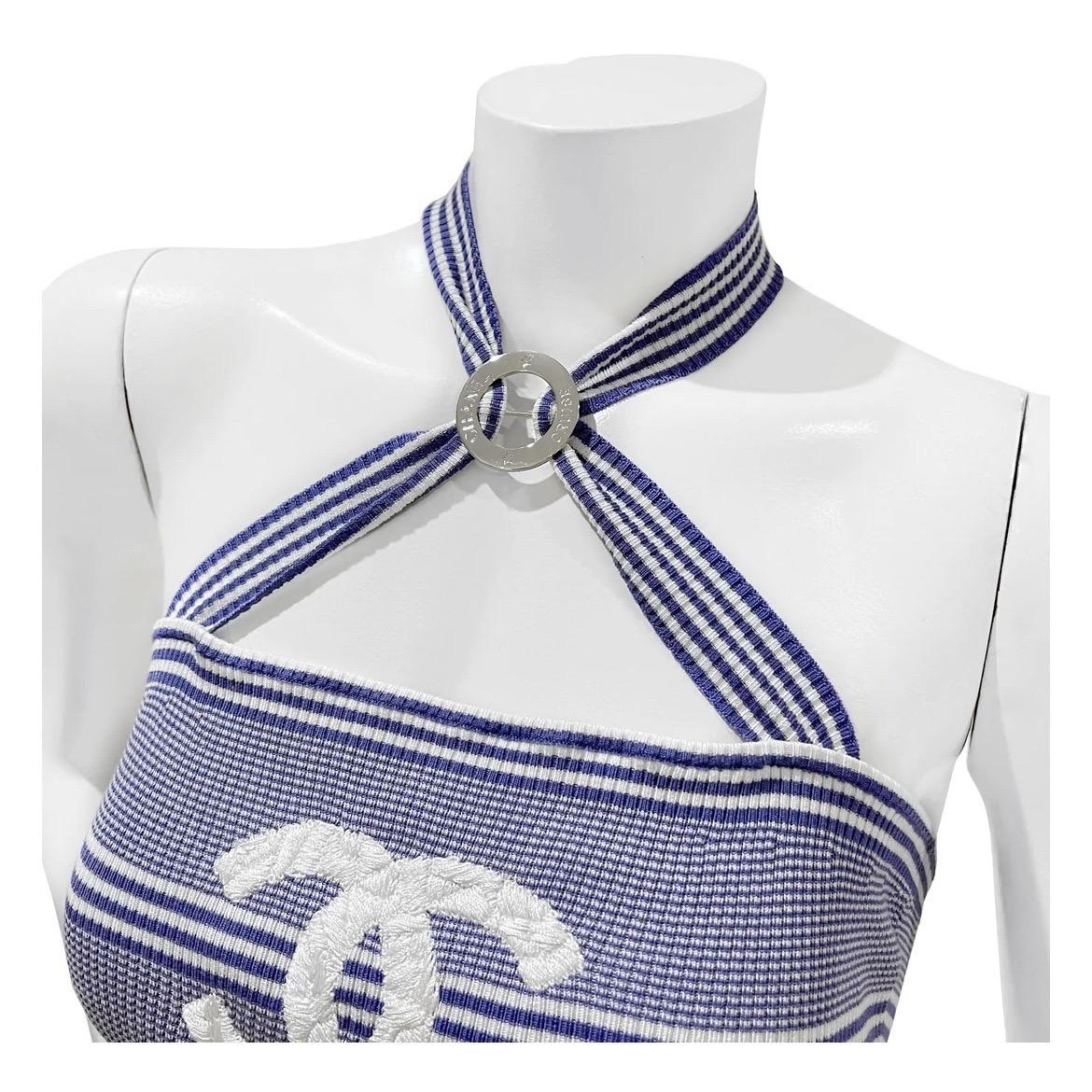 Stripe Ribbed Knit Halter CC Logo Crop Top by Chanel
Cruise 2019
Made in Italy
Knit ribbed stretchy fabric
Blue and white stripes
Large white sewn CC logo in front of top
Sleeveless 
Crop
Adjustable halter neck tie 
Back has three CC logo button