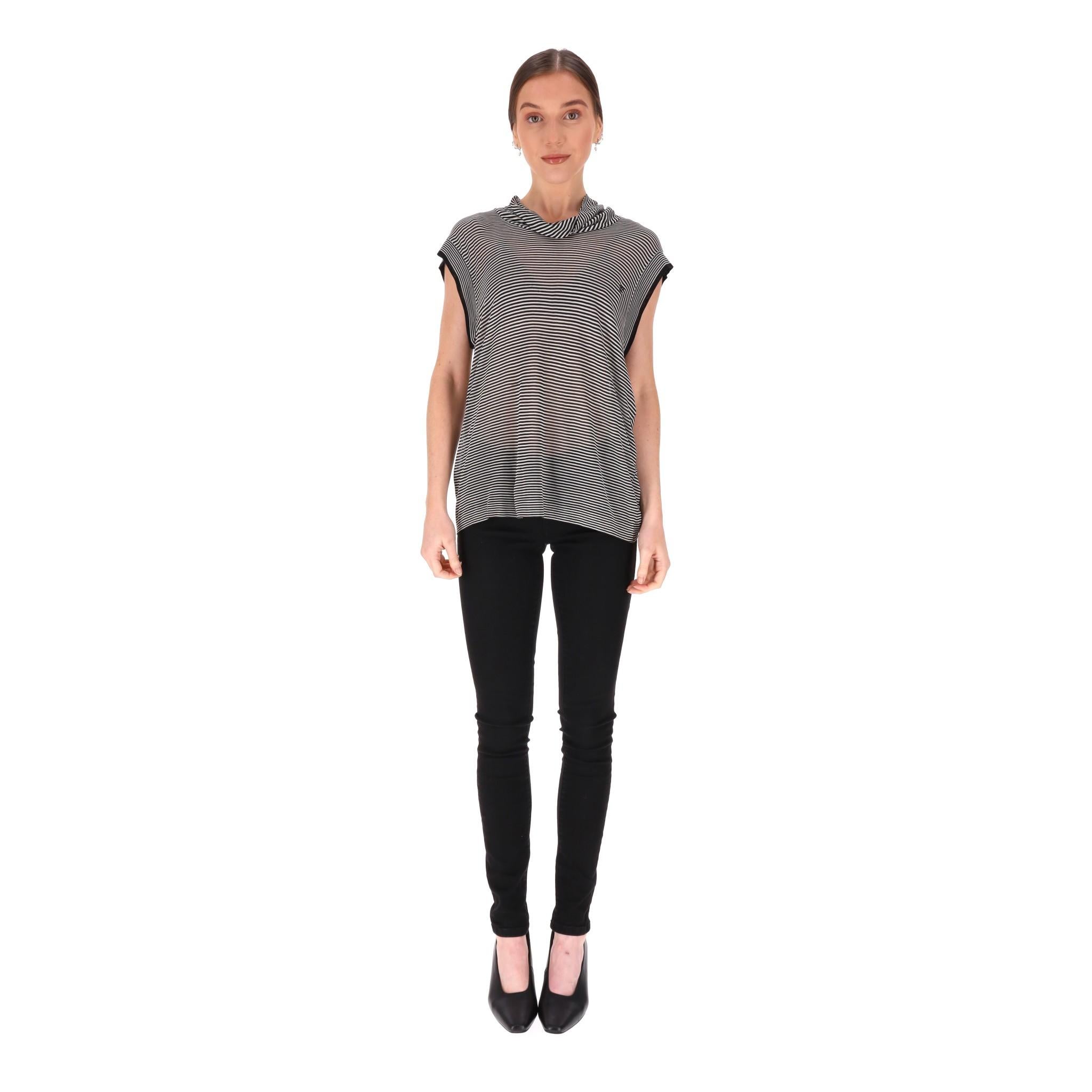 Chanel Striped 'CC' Logo Silk Top

From Cruise 2007 Collection is this white and black striped pattern blouse fully crafted from silk.

Detailed with black 'CC' logo embroidery to the chest and black trimmed short sleeves.

Relaxed fit and