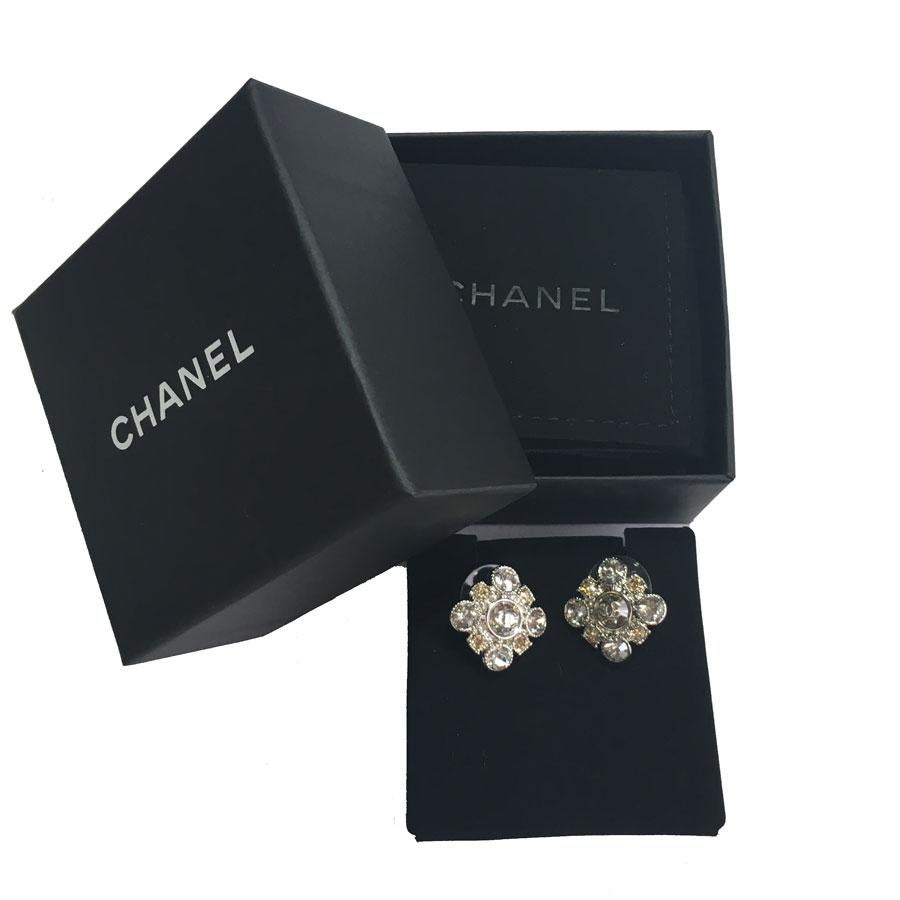 Superb Chanel stud earrings, square set with yellow and white Swarovski diamonds. A small silver metal 