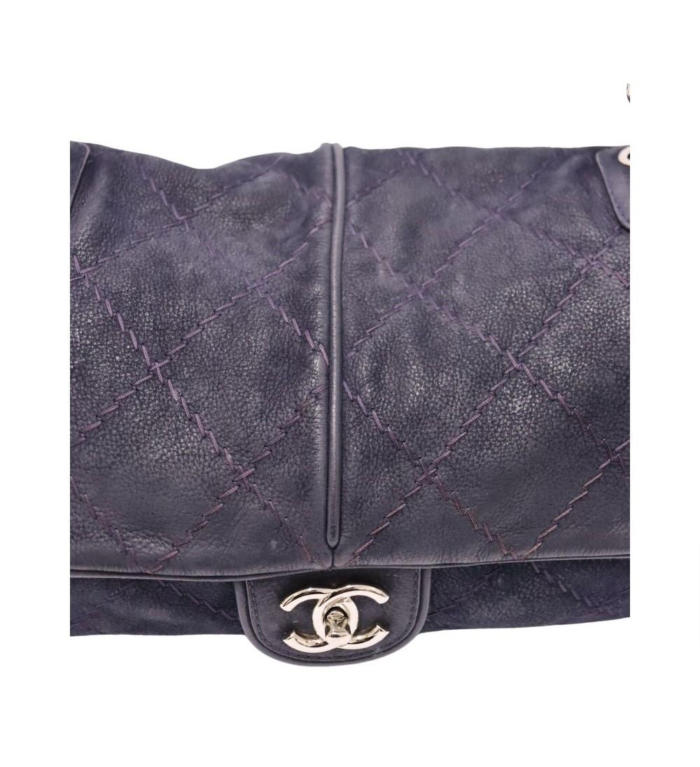Timeless elegance meets modern edge with this Chanel black distressed leather flap bag. Featuring signature diamond quilting, a front CC turn-lock closure, and iconic leather-woven chain straps, this versatile shoulder bag adds Parisian