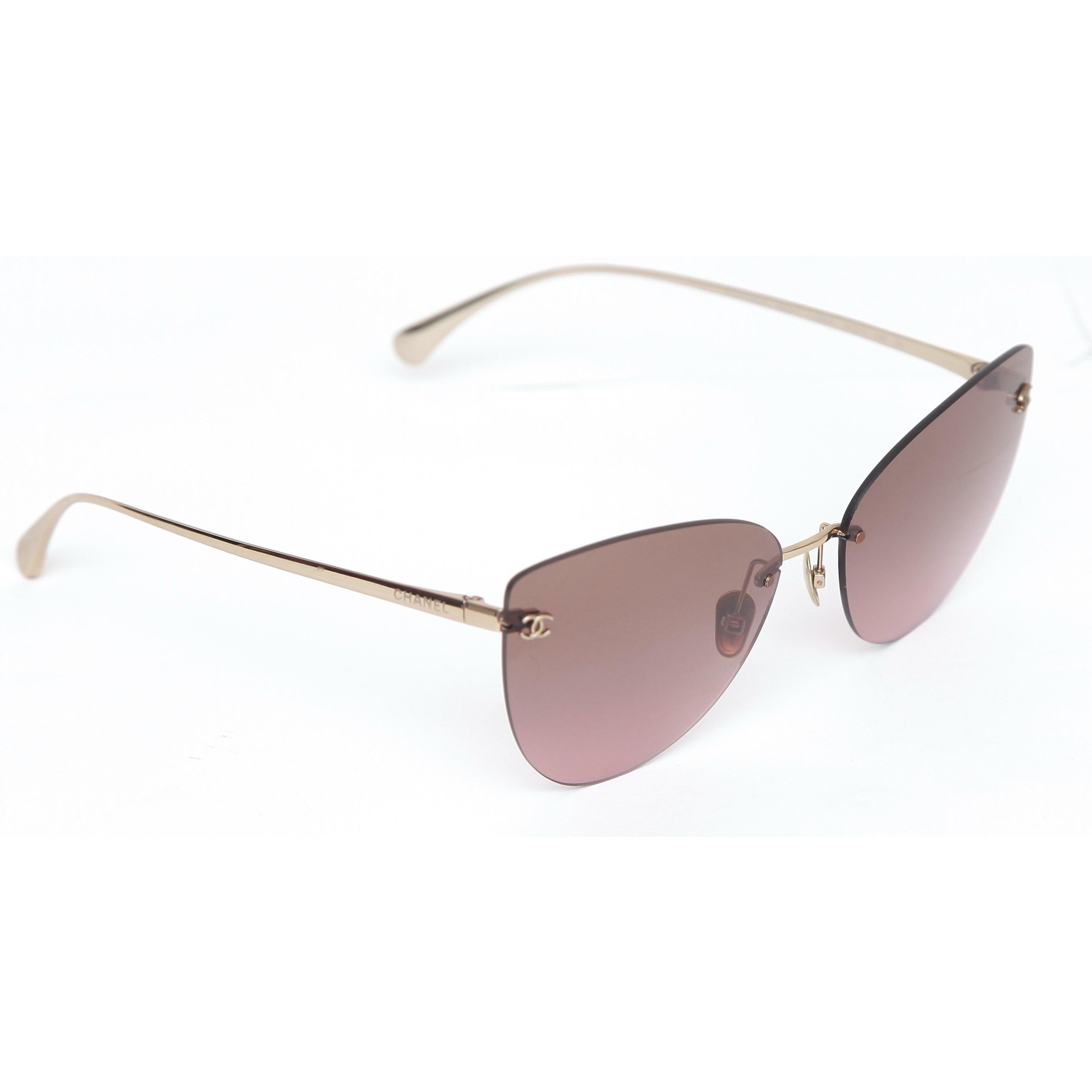 GUARANTEED AUTHENTIC CHANEL CAT EYE BROWN GRADIENT SUNGLASSES

427T C395/9T


Details: 
- Rimless cat eye shaped lens.
- Brown gradient lens.
- Gold-toned titanium arms.
- CC logo at corners.
- Comes with sunglass case and box.
- Lens Width 62mm,