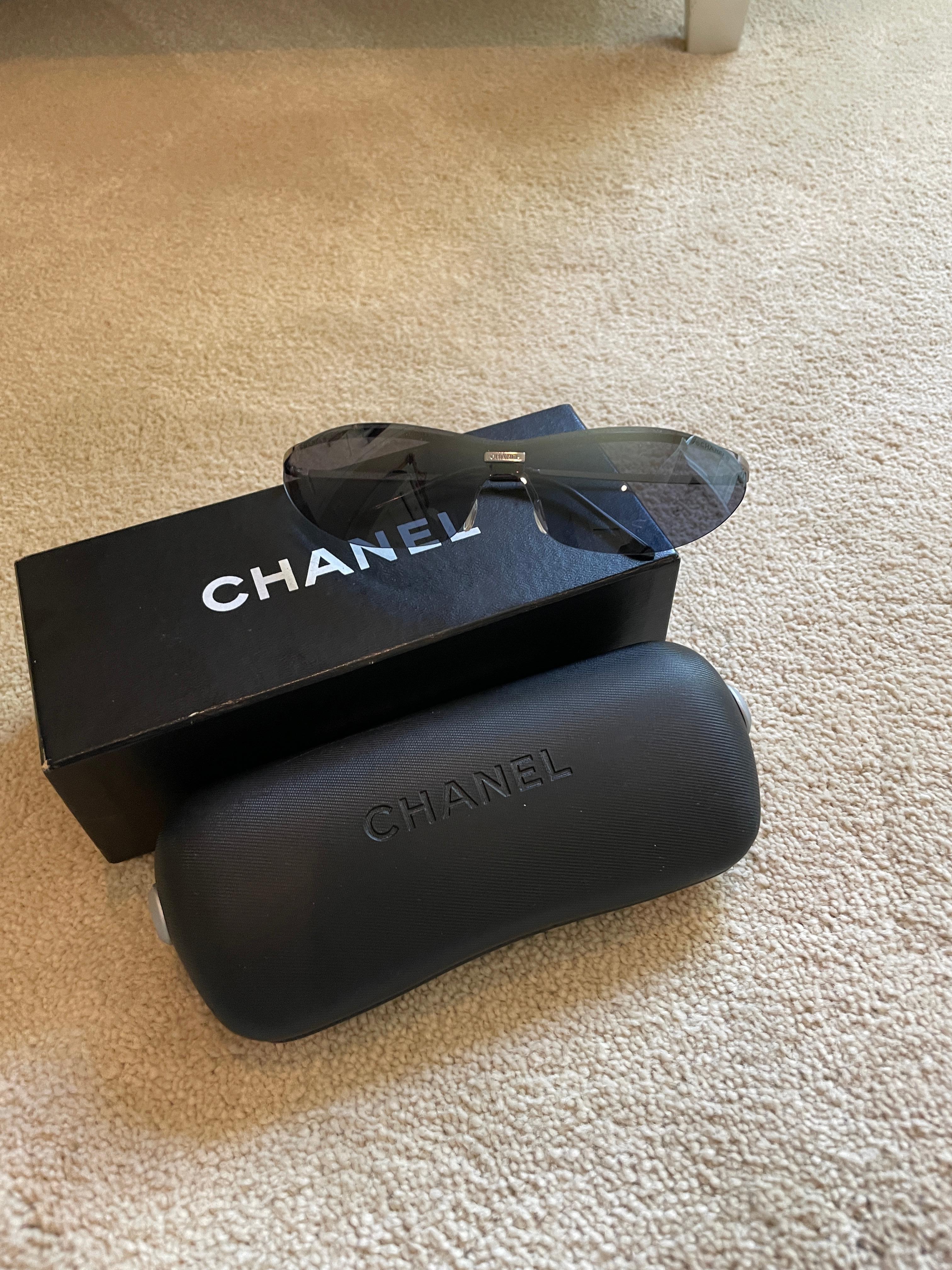 Gray lenses with silver frames, rimless, new in box no flaws Chanel skinny sleek sunglasses!