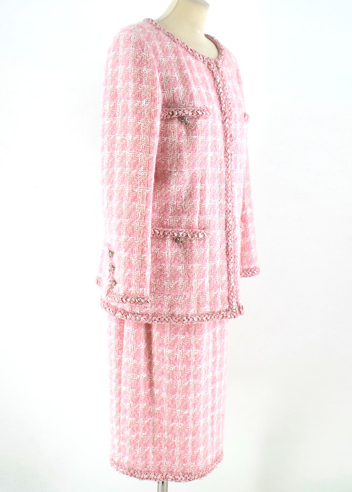 Chanel Pink & White Wool Tweed Skirt & Jacket

Blazer:

- Classic Chanel Tweed jacket 
- Silver tone zip fastening to the front
- Four front slip pockets with buttons
- Round neck 
- Light shoulder padding 
- Braid embellishing to the trims
- Silk