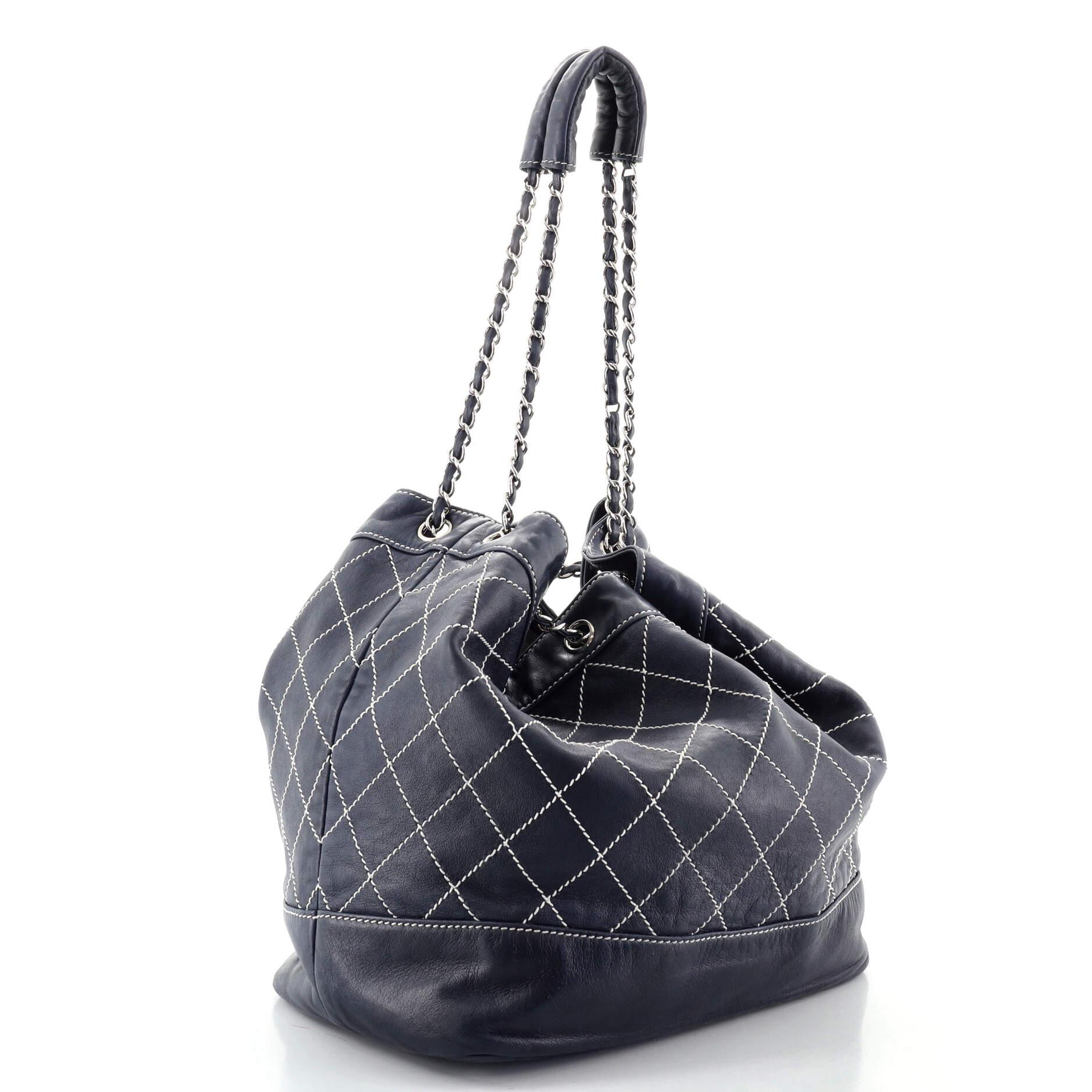 Condition: Fair. Odor in interior. Heavy wear and separating on strap. Heavy wear on exterior edges and shoulder pad, creasing and wear on exterior, stains on base. Discoloration on opening edge, wear and small stains in interior, scratches on