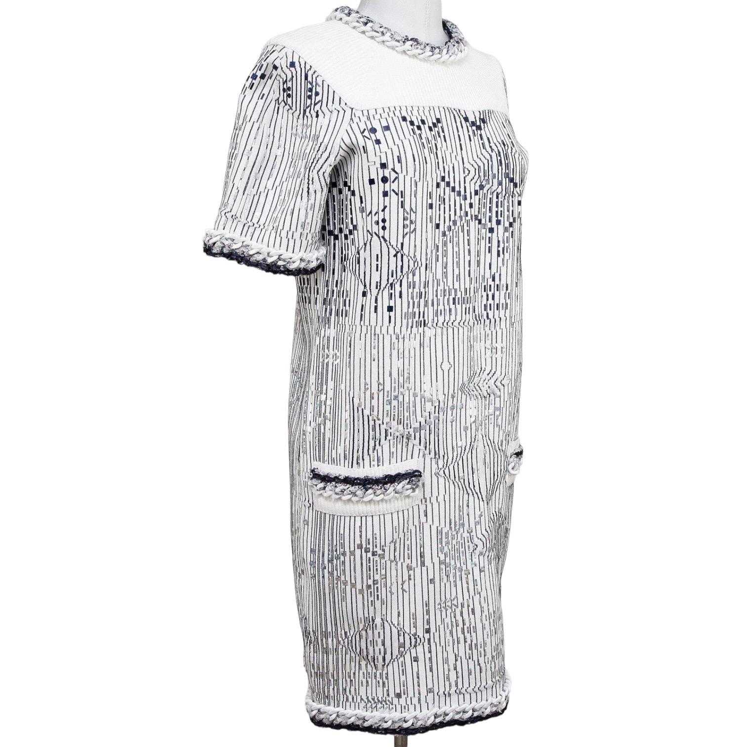 GUARANTEED AUTHENTIC SPRING 2014 TERRIFIC CHANEL METALLIC KNIT SHIFT DRESS
 Retail: $6800

 

Design:
- Blue and silver metallic pattern on a white stretchy knit dress.
- Chain accents.
- Slip pockets at hips.
- Slip on style with rear keyhole and