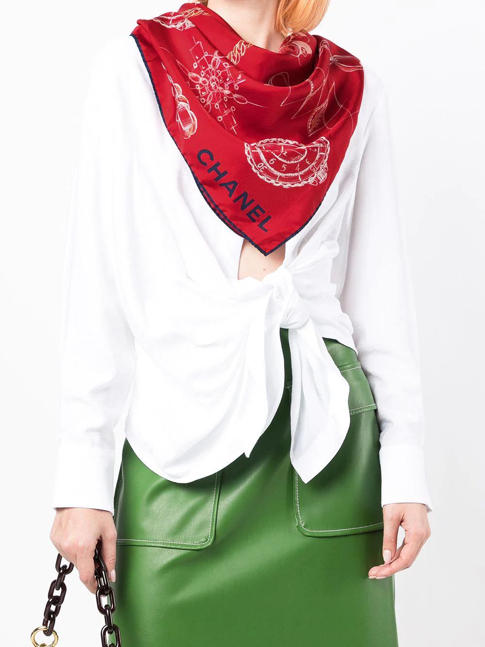 Inspired by all that is Chanel - the classic flap bag, Chanel no.5 perfume, statement cuffs, the camellia flower and the signature quilted pattern, this pre-owned 100% silk red scarf has been delicately bordered with a navy pipe trim. The chicest