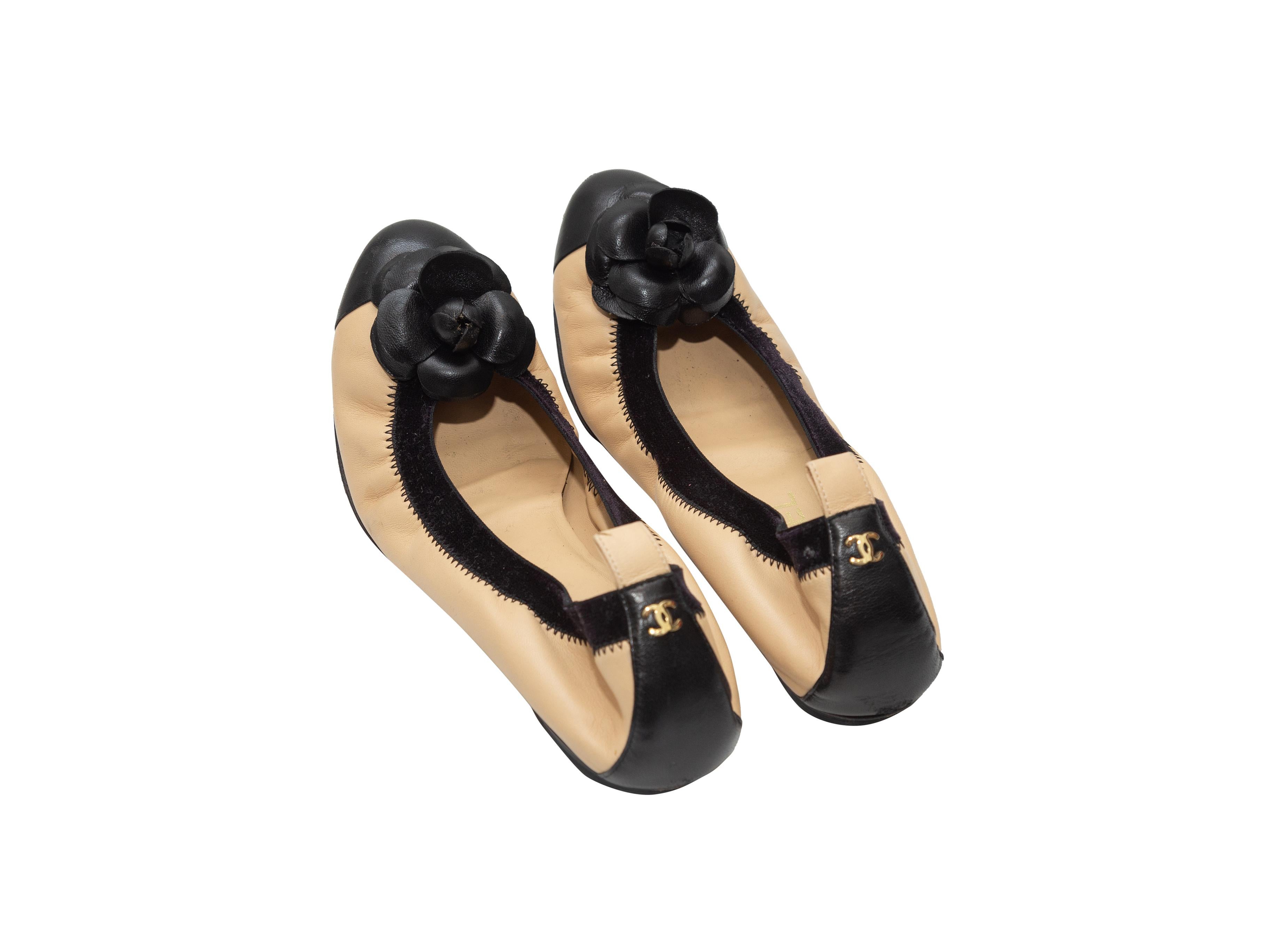 tan and black flats