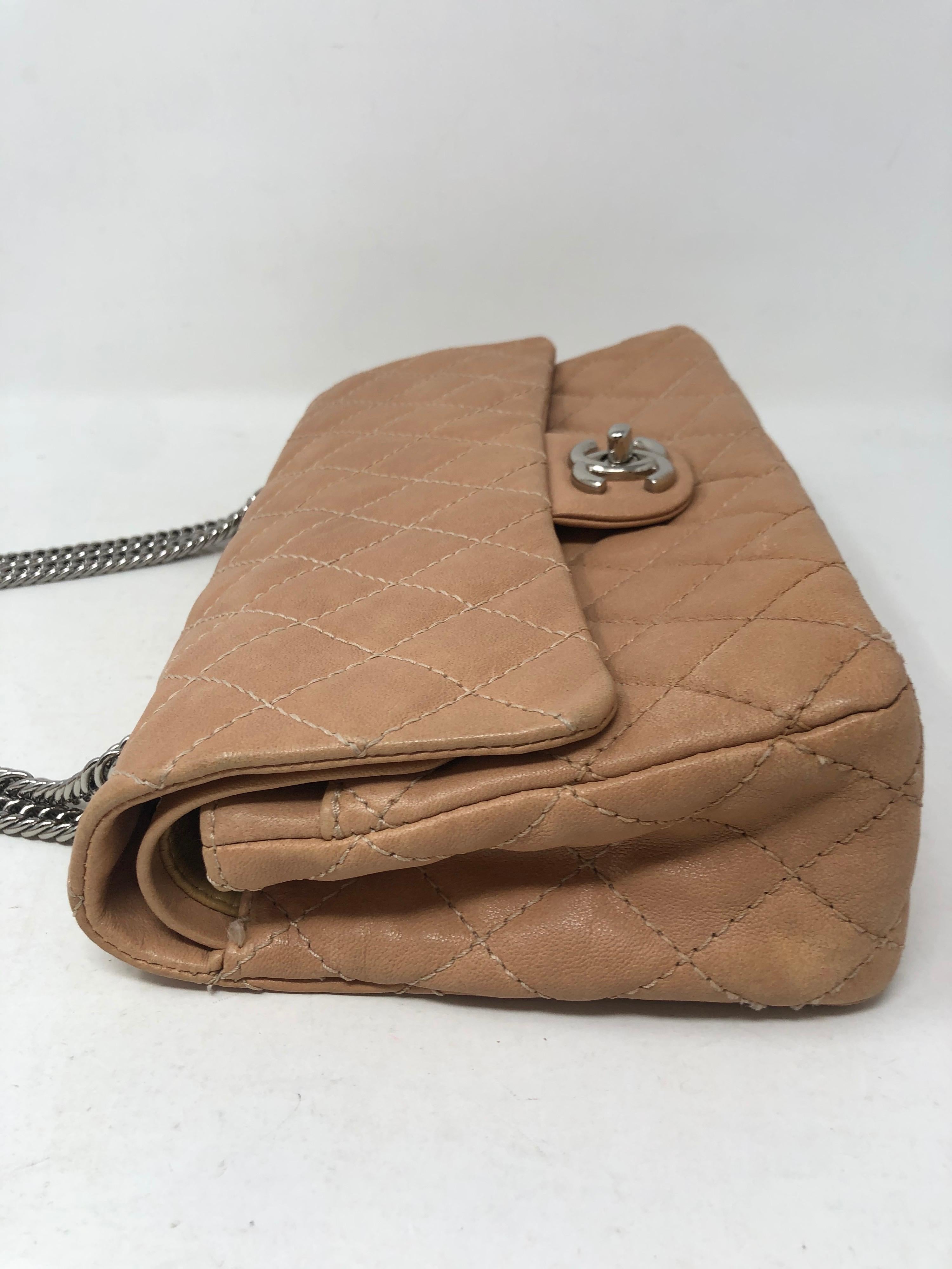 Chanel Tan Double Flap Bag. Unique silver hardware. Nice neutral color for all seasons. Good condition. Medium 10