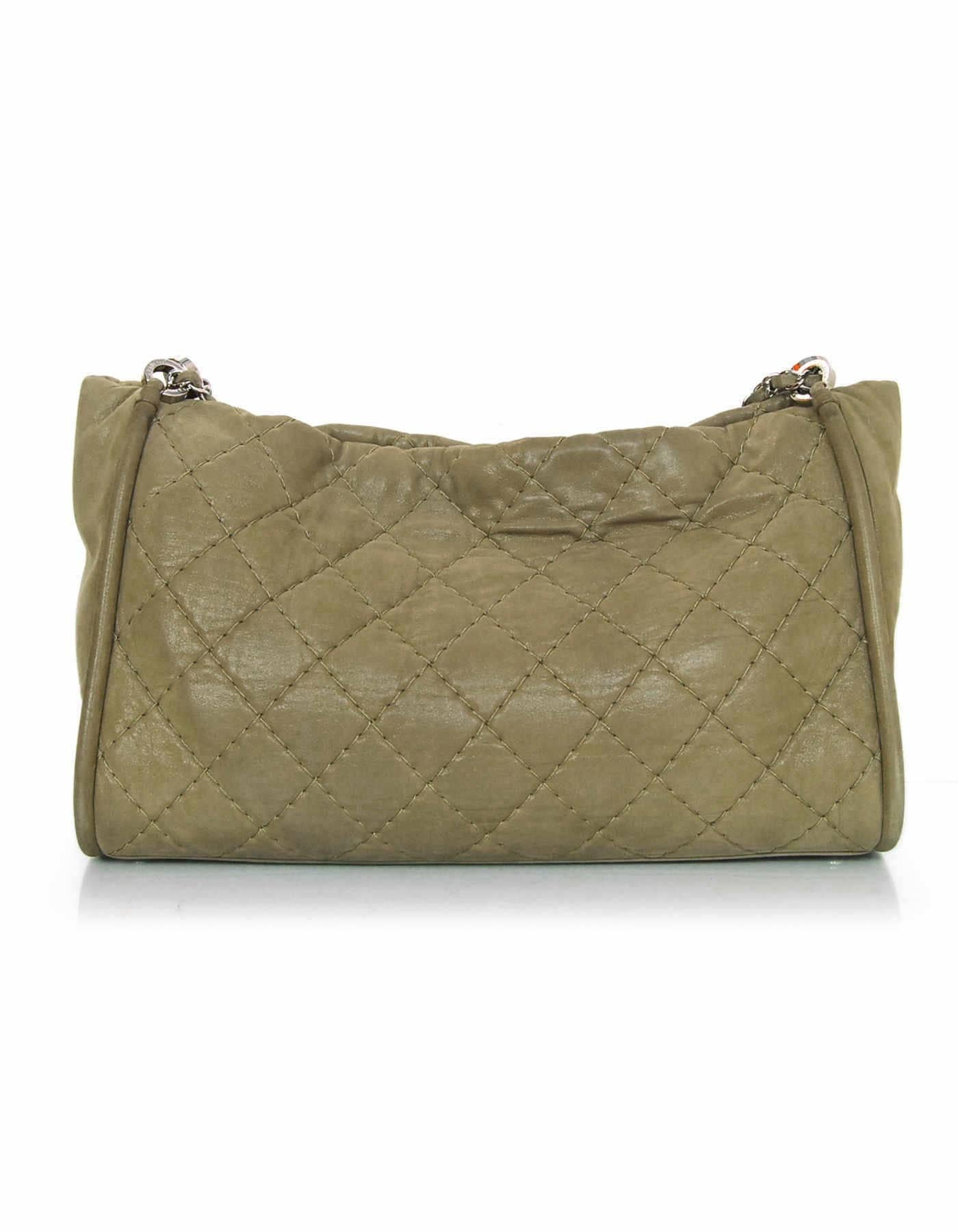 Chanel Tan Iridescent Quilted Calfskin Shoulder Bag 
Features adjustable shoulder strap and silvertone CC on front of bag 

Made In: Italy
Year of Production: 2012
Color: Tan
Hardware: Silvertone
Materials: Iridescent calfskin
Lining: Grey