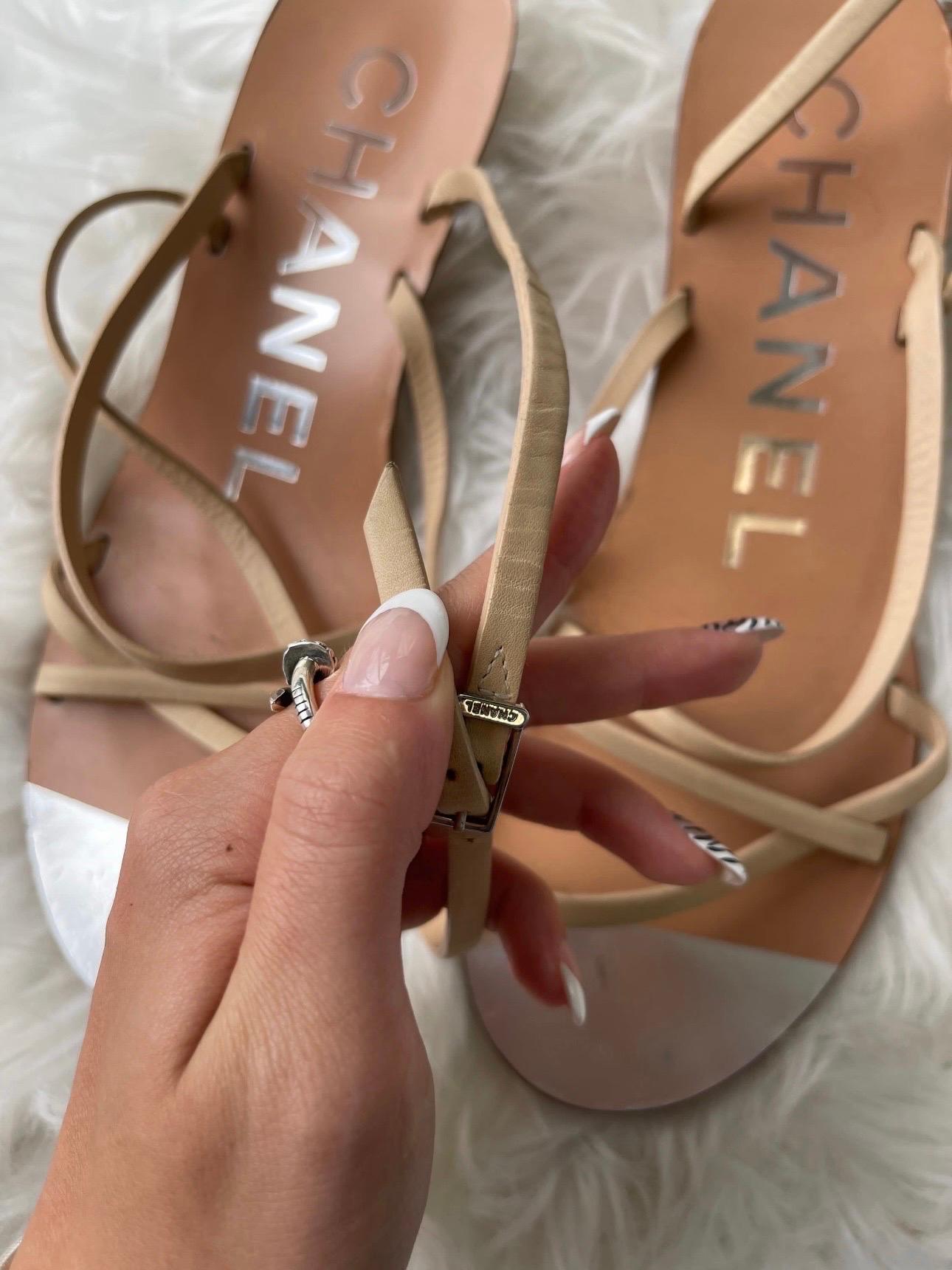 🖤 Chanel Leather Wedge Sandals 🖤

Nude leather Chanel wedge sandals, with silver-tone interlocking CC at wooden heel and buckle closure at ankles. 

Good condition. Moderate scuffs at soles; moderate wear at insoles; light creasing and wear to