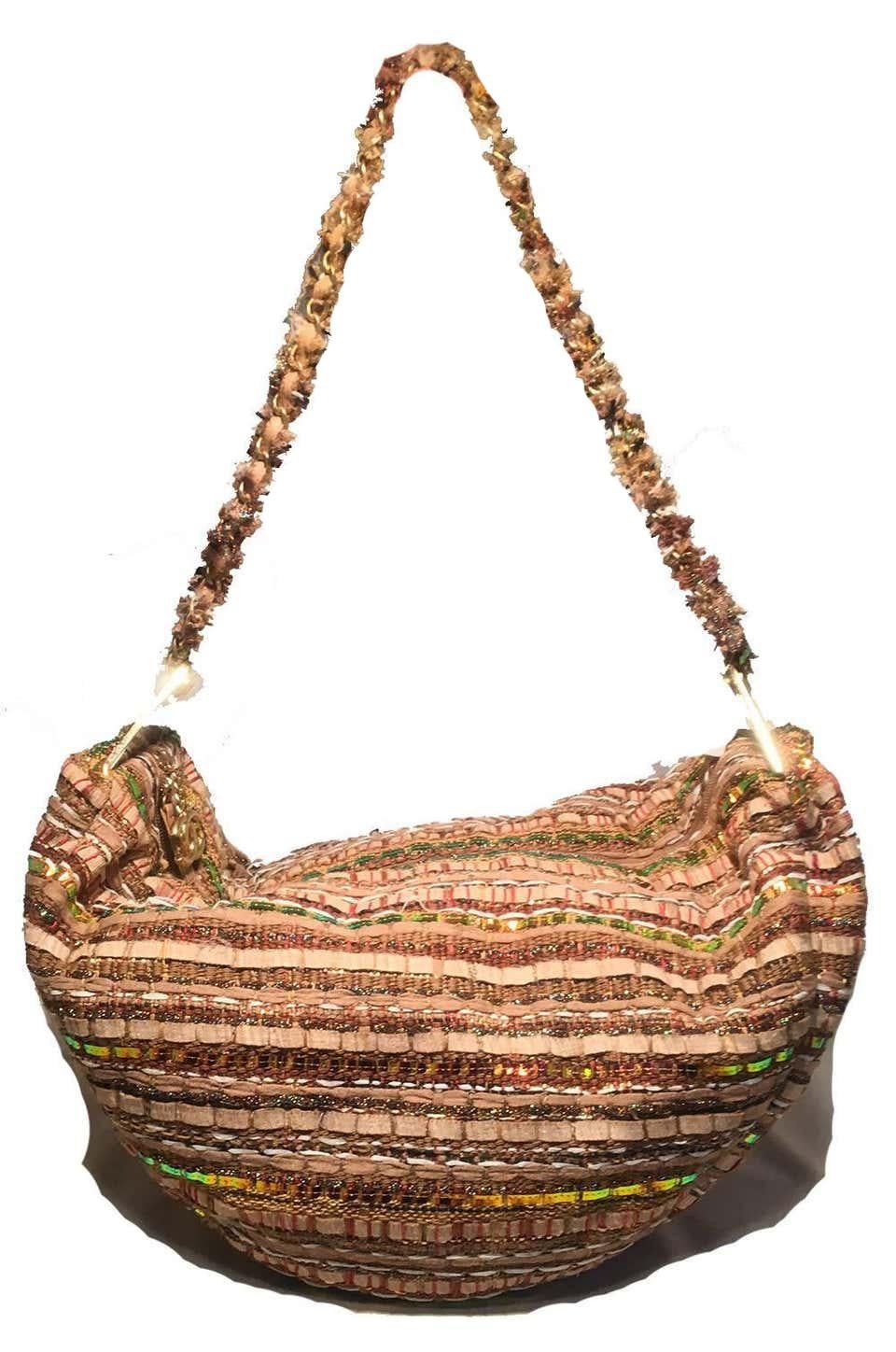 Chanel Tan Tweed & Sequin Woven Hammock Hobo Shoulder Bag.  Various woven stripes of tweed, holographic sequins and shimmering threads give this piece a pop sparkle while remaining neutral and unique.  Gold hardware along both ends of long shoulder