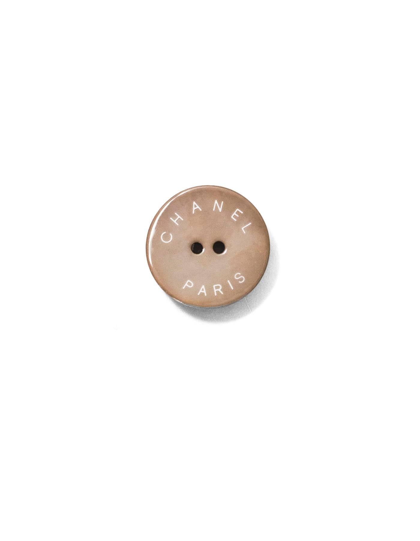 Chanel Taupe CHANEL PARIS Glass Buttons
Features set of two 22mm buttons and one 18mm button

Color: Taupe
Materials: Glass
Stamp: Chanel Paris
Overall Condition: Excellent good pre-owned condition, light surface marks/soiling

Measurements: