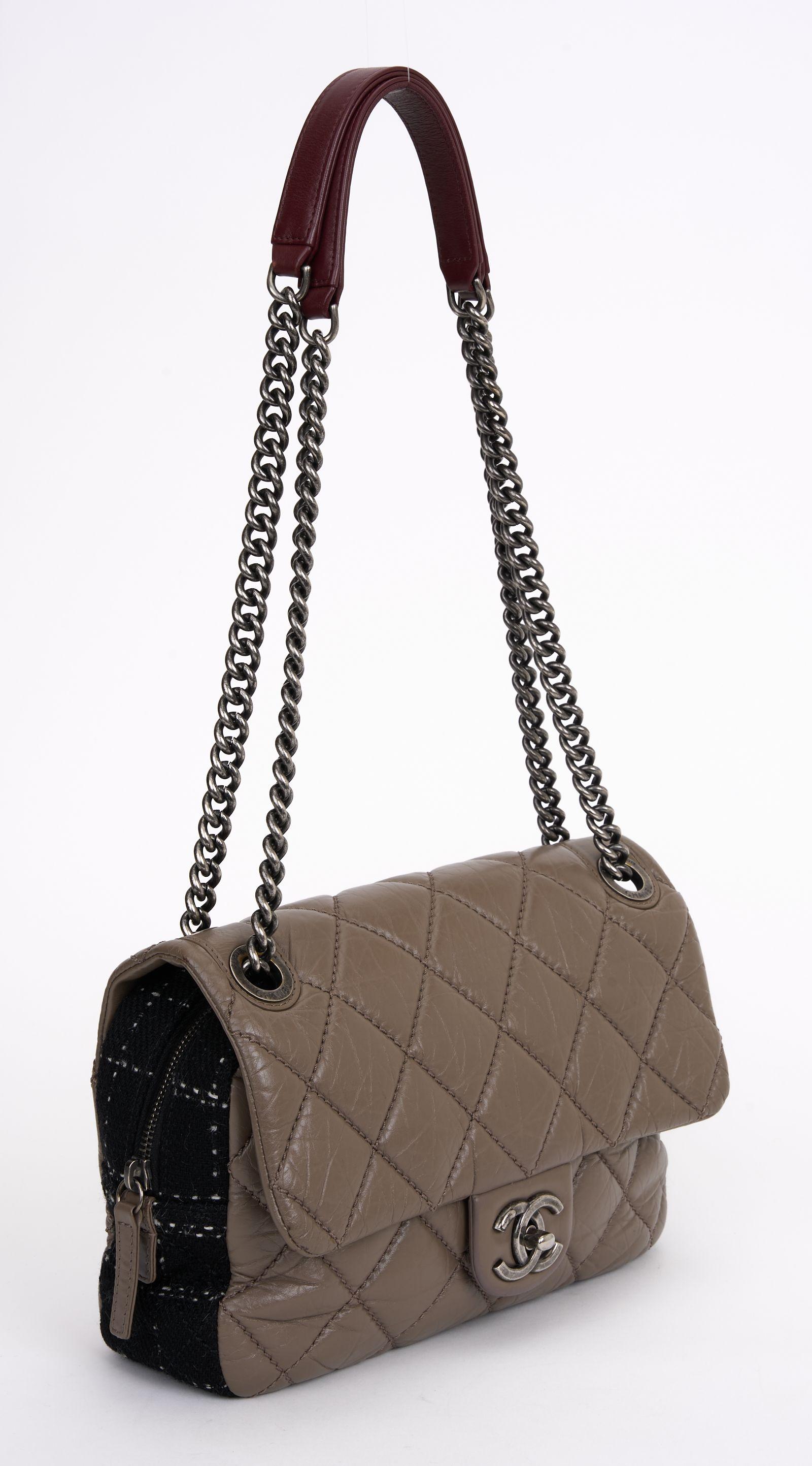 This Chanel shoulder bag from the Fall 2013 collection by Karl Lagerfeld features quilted calfskin, interlocking CC logo, gunmetal hardware and a wool interior trim. Dust Cover and ID included. First two numbers of hologram are 18.
Strap Drop - 12