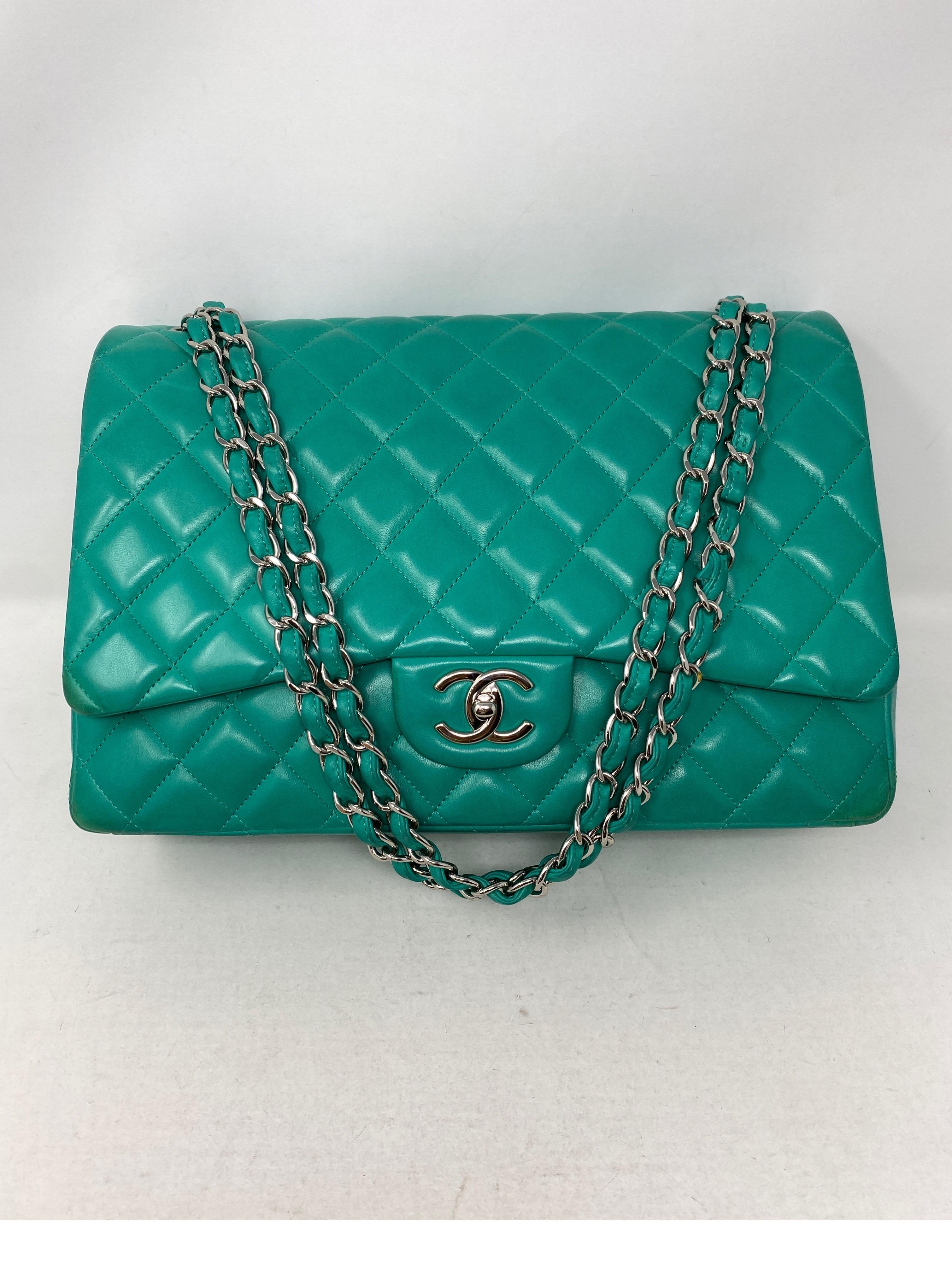 Chanel Teal Maxi Double Flap Bag. Silver hardware. Gorgeous rare teal color. Has light wear discoloration on corners. Not very noticeable. Please check photos. Hard to find in this color. Don't miss out. Serial number inside bag. Guaranteed