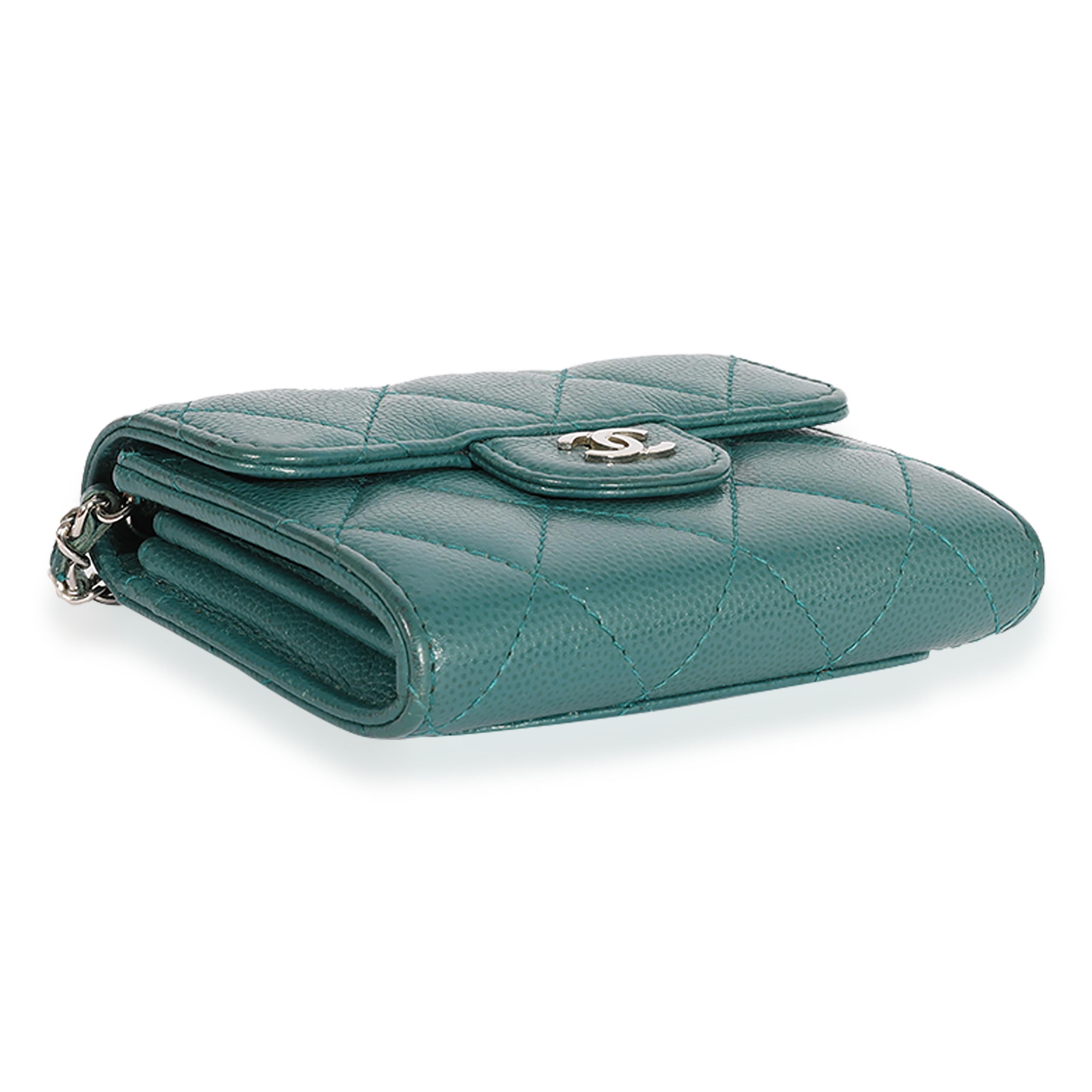Listing Title: Chanel Teal Quilted Caviar Classic Card Holder on Chain
SKU: 119454
Condition: Pre-owned 
Handbag Condition: Very Good
Condition Comments: Very Good Condition. Scuffing to edges. Scratching to hardware. Marks and discoloration at