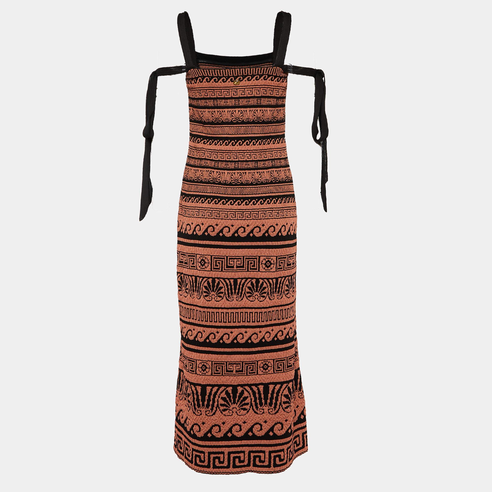 An exquisite fusion of class and grace, this Chanel dress will lend you endless style. This piece is nothing but classic fashion. Detailed with lovely patterns all over, the maxi dress has tie details and a gorgeous fit.

