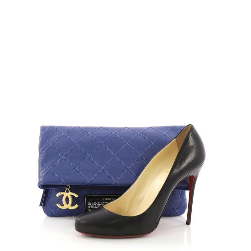 This Chanel Thin City Clutch Quilted Calfskin Small, crafted from blue quilted calfskin leather, features large antiqued gold-tone CC zipper pull, zip and slip compartments under flap, and gold-tone hardware. It flap and zip closure opens to a blue