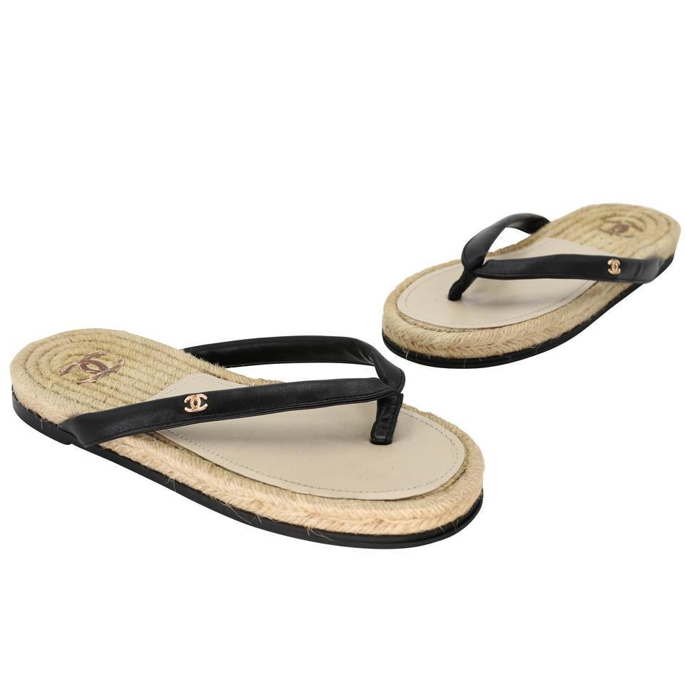Chanel Signature sandals with elegant CC Logo on front of sandals. They feature T strap with leather threaded embellishment. These are excellent sandals for casual attire and for a timeless look! The Amazing CC logo and design captures the essence