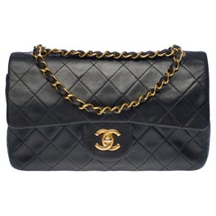 Chanel Timeless 23 cm double flap shoulder bag in black quilted lambskin, GHW