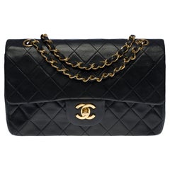 Used Chanel Timeless 23cm double flap shoulder bag in black quilted lambskin, GHW