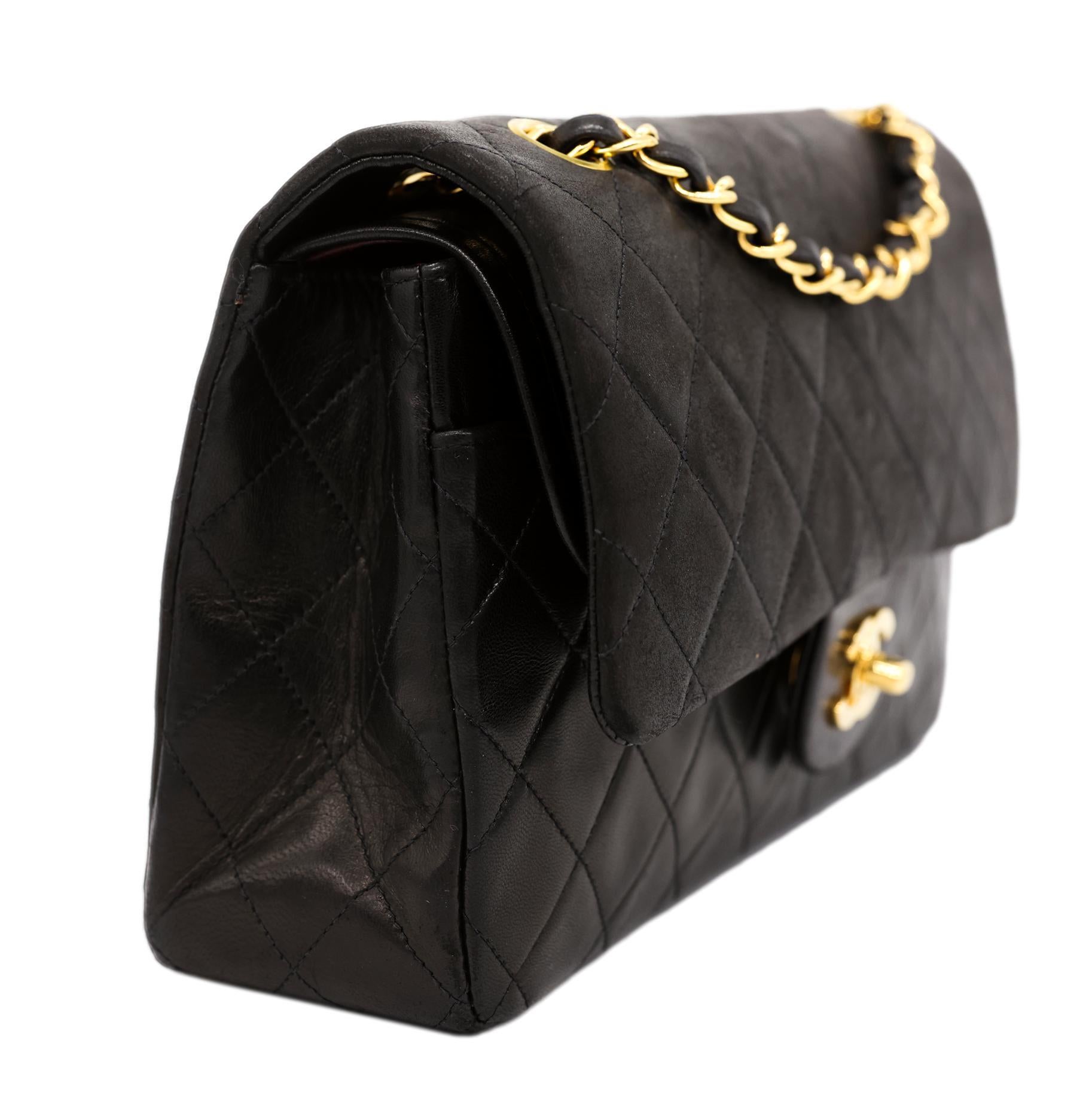 Chanel Timeless Black Medium Double Flap Quilted Lambskin Shoulder Bag with Gold Hardware, 2019. The iconic Chanel bag was originally issued by Coco Chanel in February 1955 which became the very first socially acceptable shoulder bag for the modern