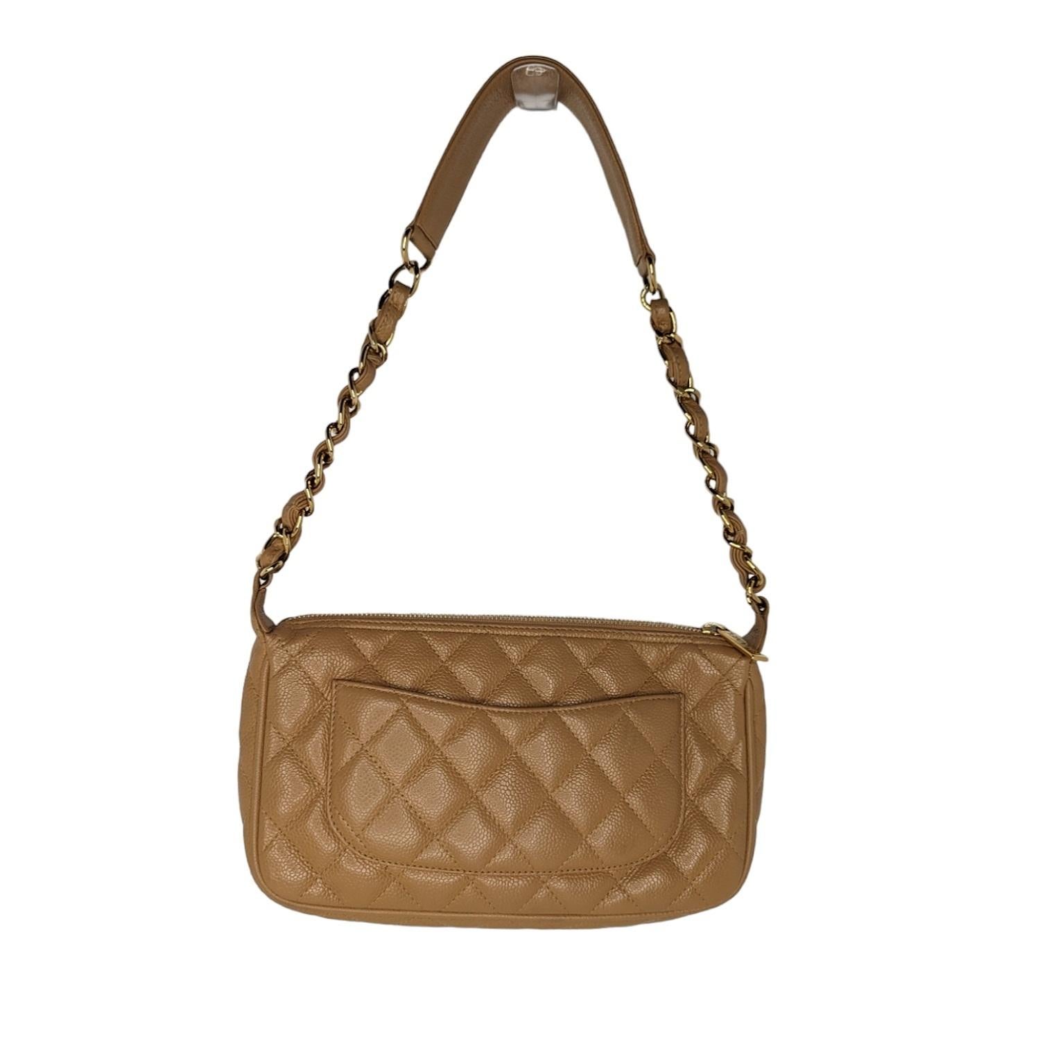 Dark Beige quilted Caviar leather Chanel Timeless hobo with gold-tone hardware, single chain-link and leather shoulder strap, CC logo appliqué at front, exterior patch pocket at back, tonal grosgrain lining, single zip pocket at interior wall and