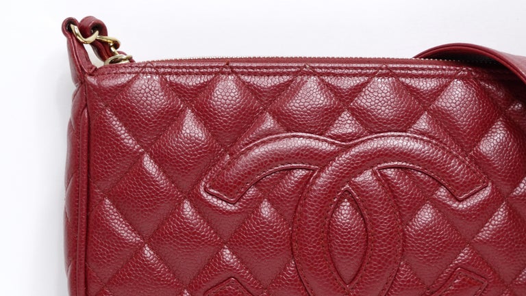 This chic and sophisticated Chanel Beige Quilted Caviar Leather Timeless CC Shoulder Bag is made for everyday elegance. This durable and hot red quilted caviar leather features a sleek design with a stitched CC logo and a comfortable chain shoulder