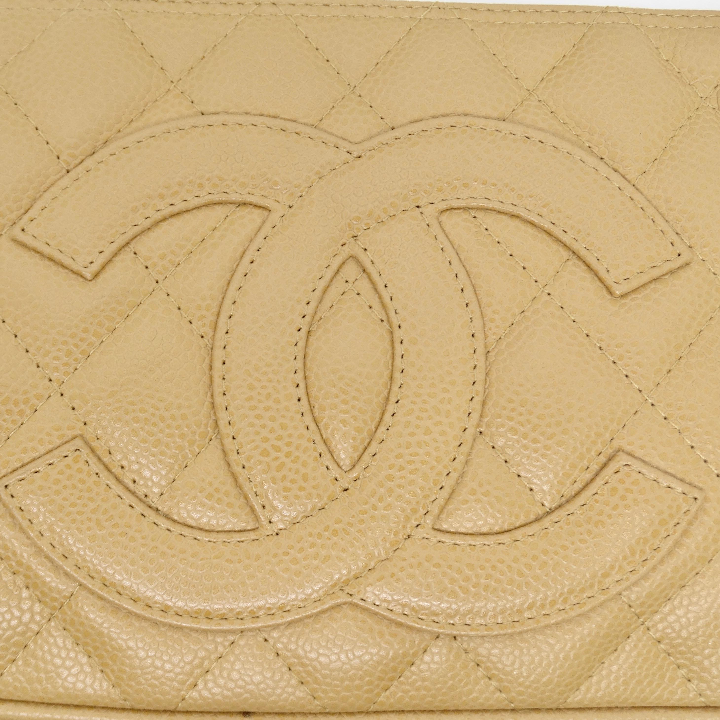 Introducing the Chanel Timeless CC Shoulder Bag – an epitome of elegance and sophistication. Crafted from beige quilted leather, this shoulder bag is adorned with the iconic and unmistakable Chanel interlocking 'C' logo prominently displayed on the