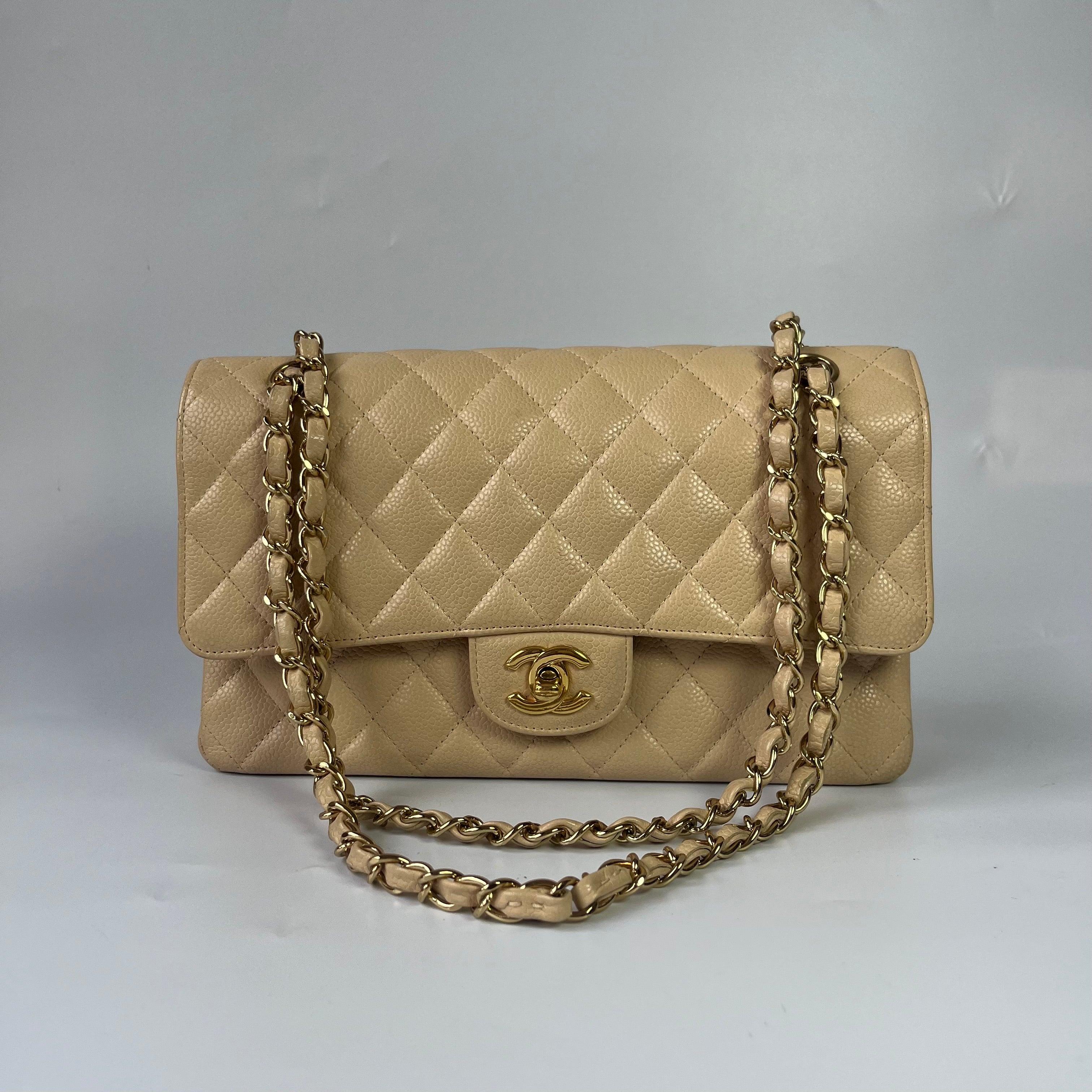 Chanel Timeless Classic Flap Medium Beige Caviar Leather Gold Hardware, 2009-2010

  This one-of-a-kind Chanel Classic Flap Vintage bag exudes sophistication and timeless elegance. Crafted from luxurious beige caviar leather.
  CONDITION: VERY GOOD

