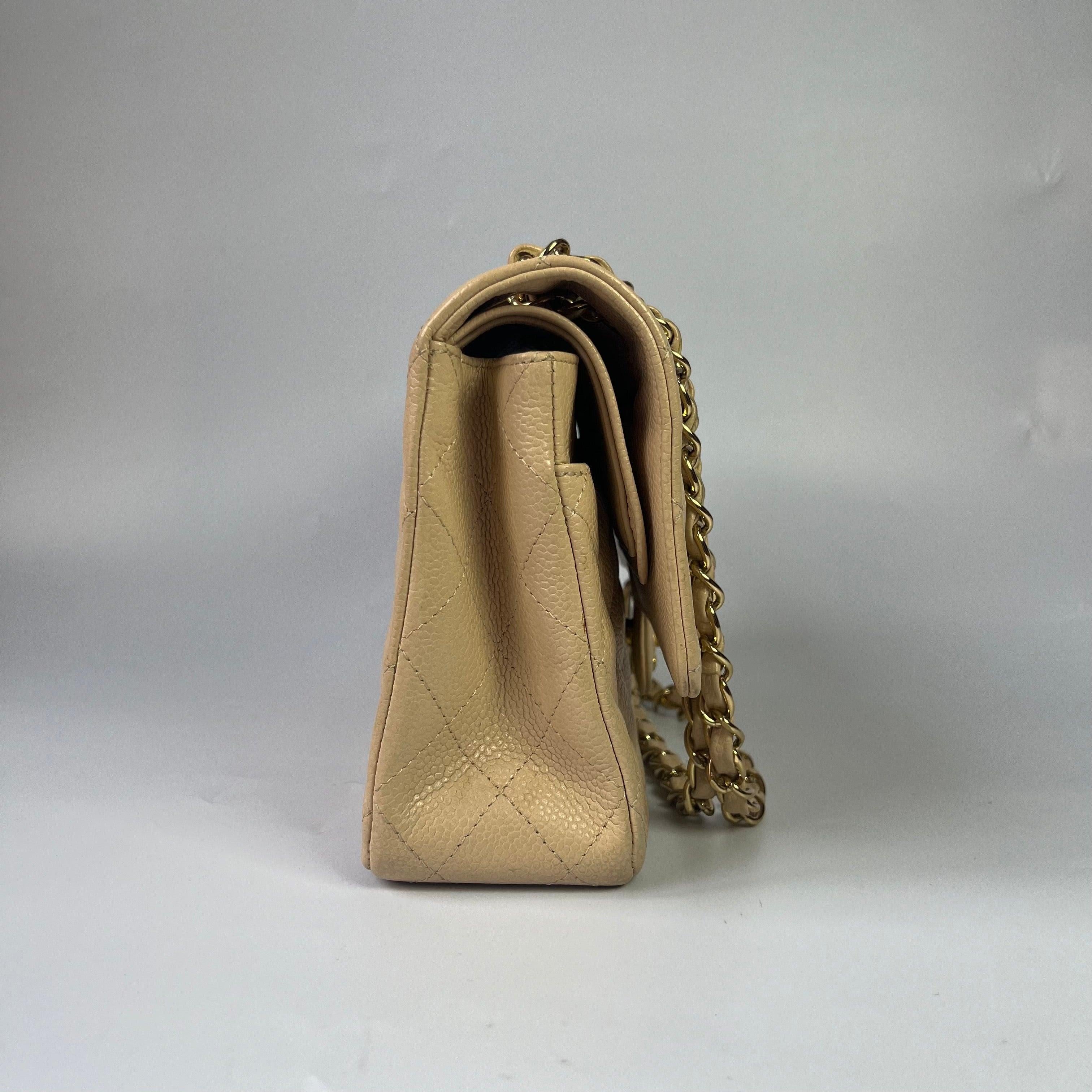 Chanel Timeless Classic Flap Medium Beige Caviar Leather Gold Hardware 2009-2010 In Excellent Condition In AUBERVILLIERS, FR