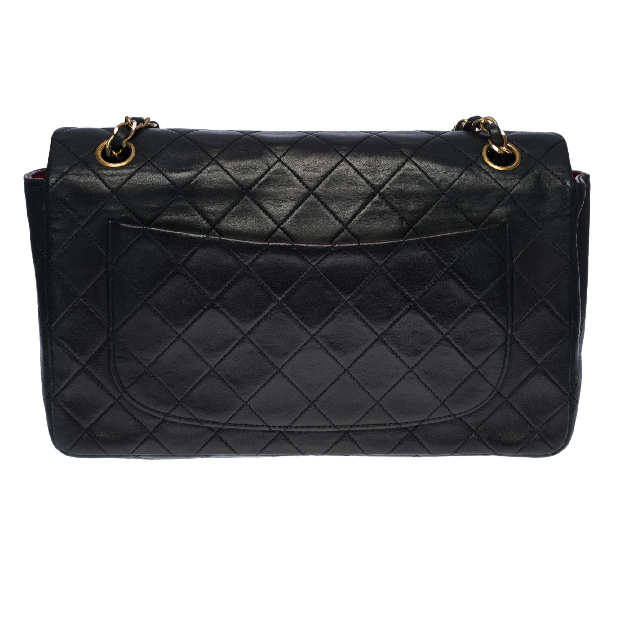 The amazing Chanel Timeless/Classic 27cm Flap shoulder bag in black quilted leather, gold-tone metal hardware, gold-tone metal chain interlaced with black leather for a shoulder and shoulder strap 
 
Backpack pocket 
Flap closure, gold-tone CC clasp