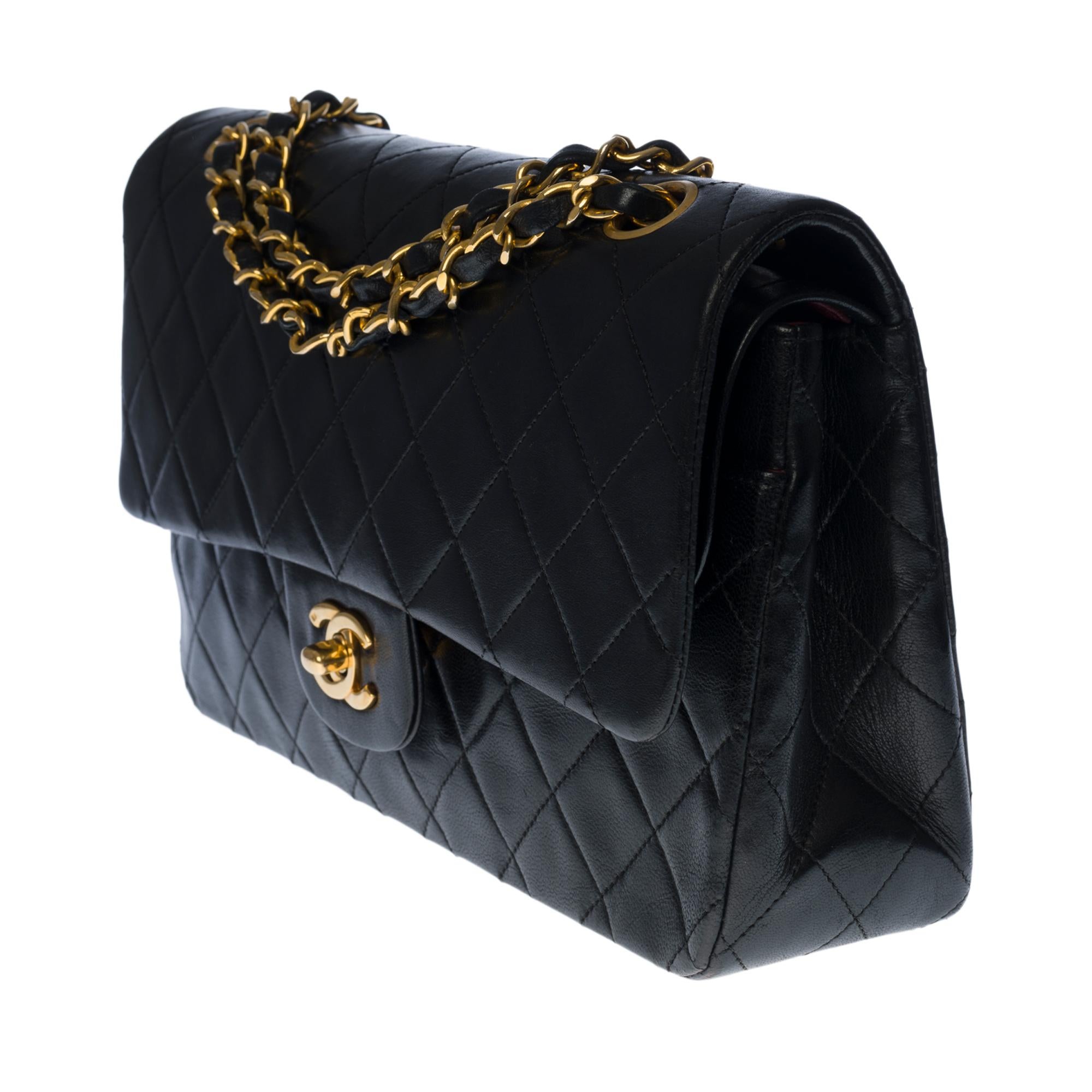 Black Chanel Timeless/Classic shoulder bag in black quilted lambskin and gold hardware