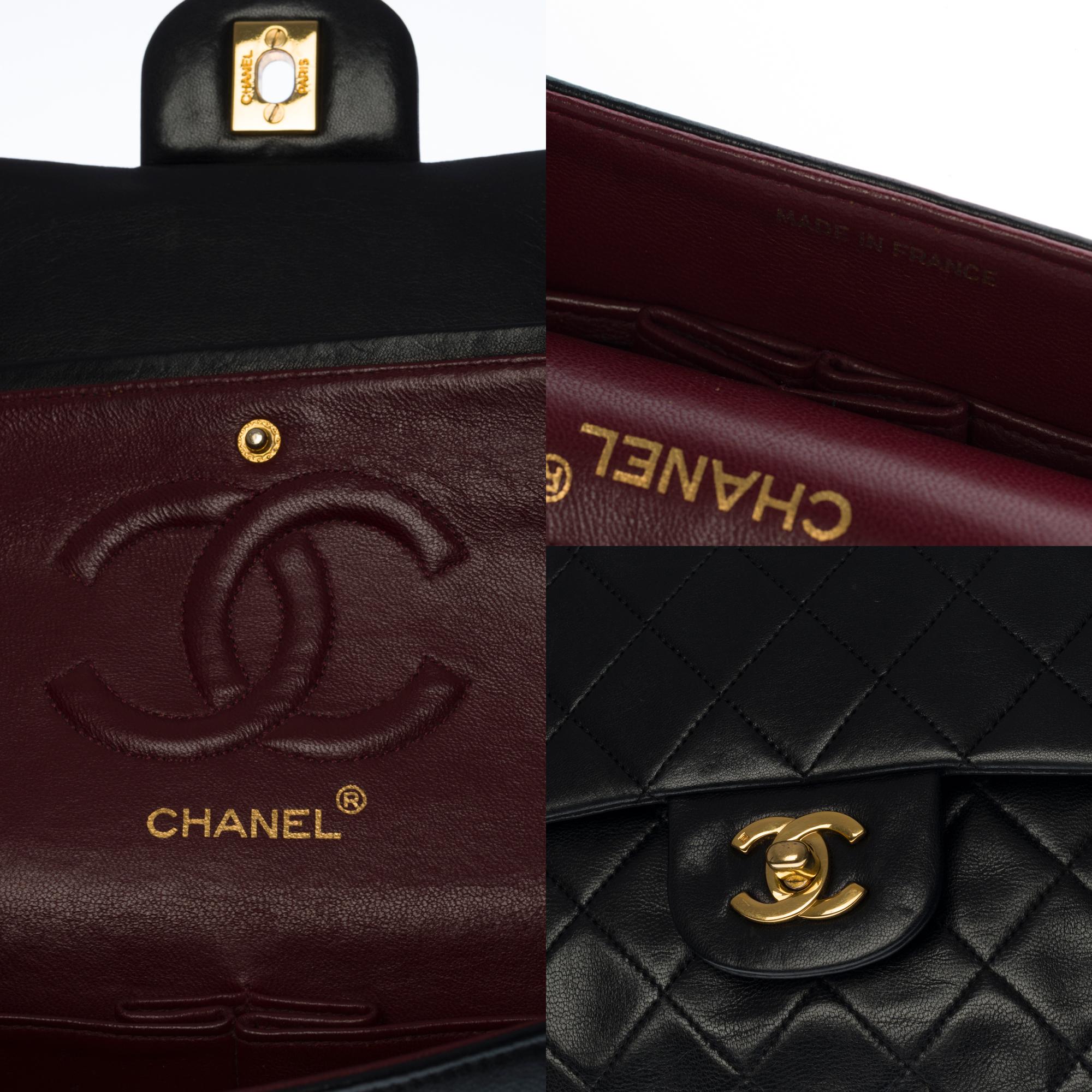 Women's Chanel Timeless/Classic shoulder bag in black quilted lambskin and gold hardware