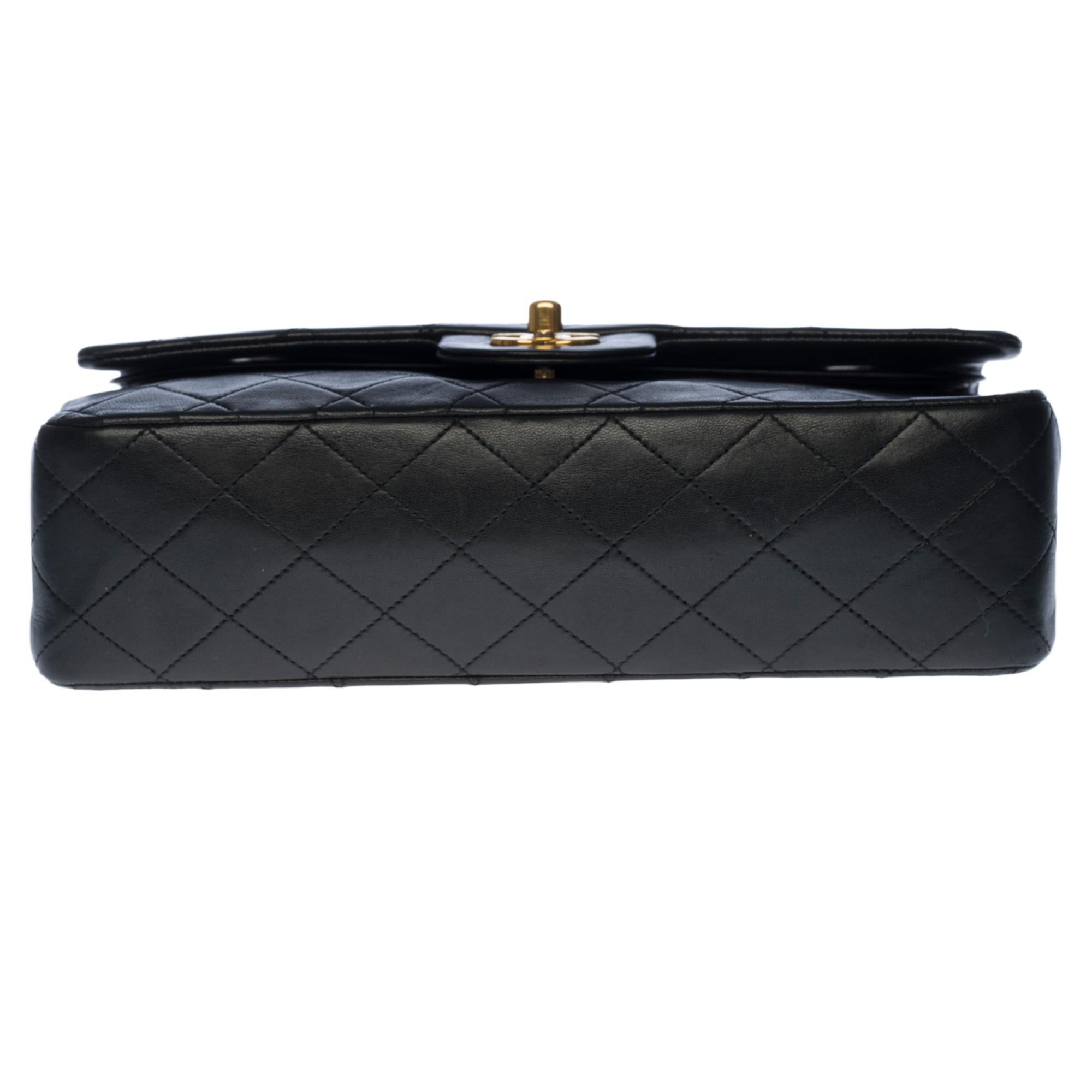 Chanel Timeless/Classic shoulder bag in black quilted lambskin and gold hardware 4