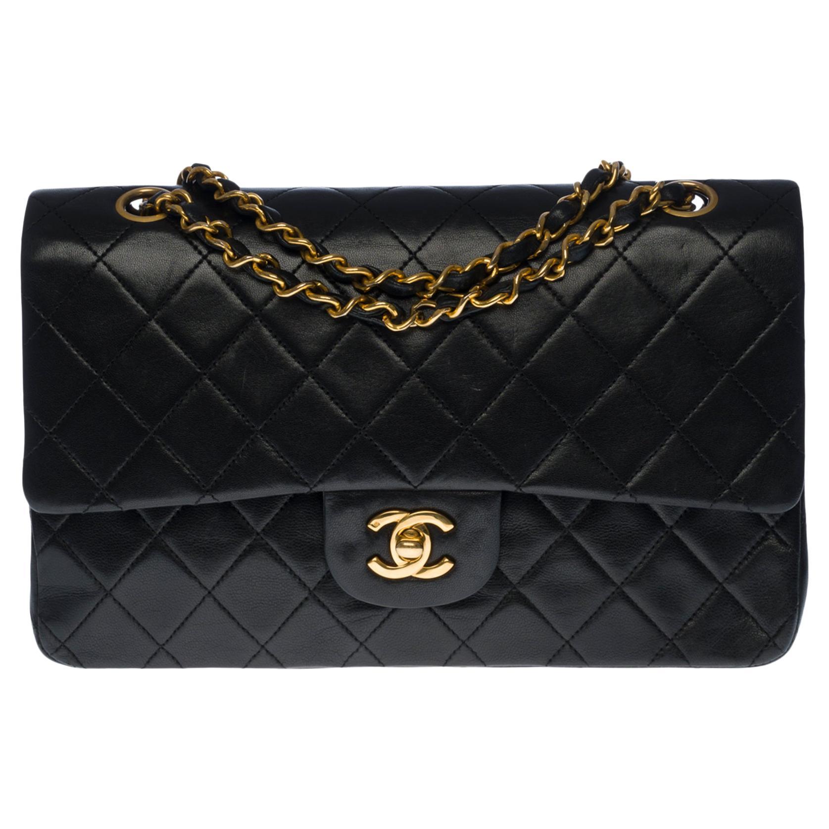 Chanel Timeless/Classic shoulder bag in black quilted lambskin and gold hardware