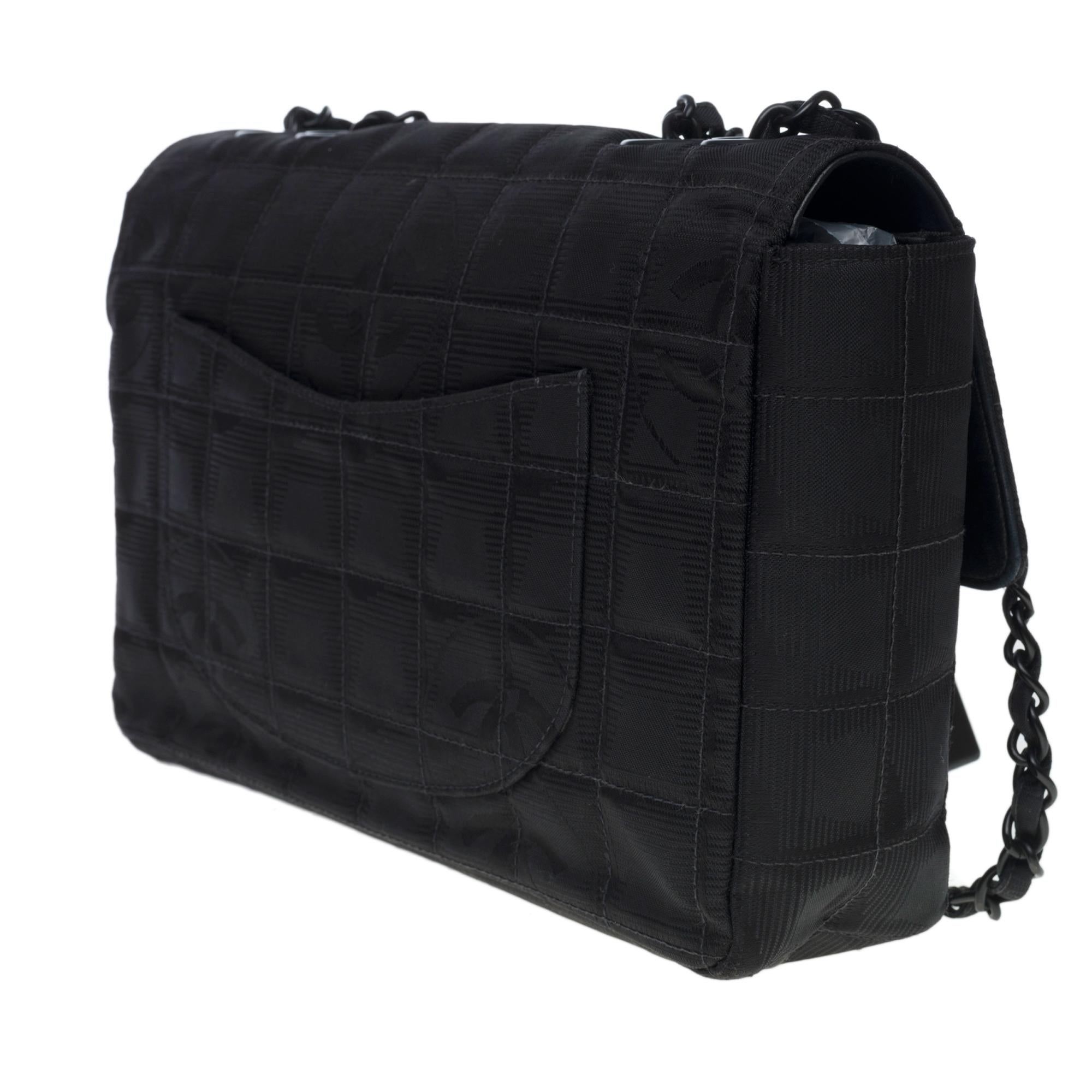 Black Chanel Timeless/Classic Travel Line flap bag in black nylon, black hardware