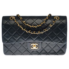 Chanel Timeless "Coco" double flap shoulder bag in black quilted lambskin, GHW