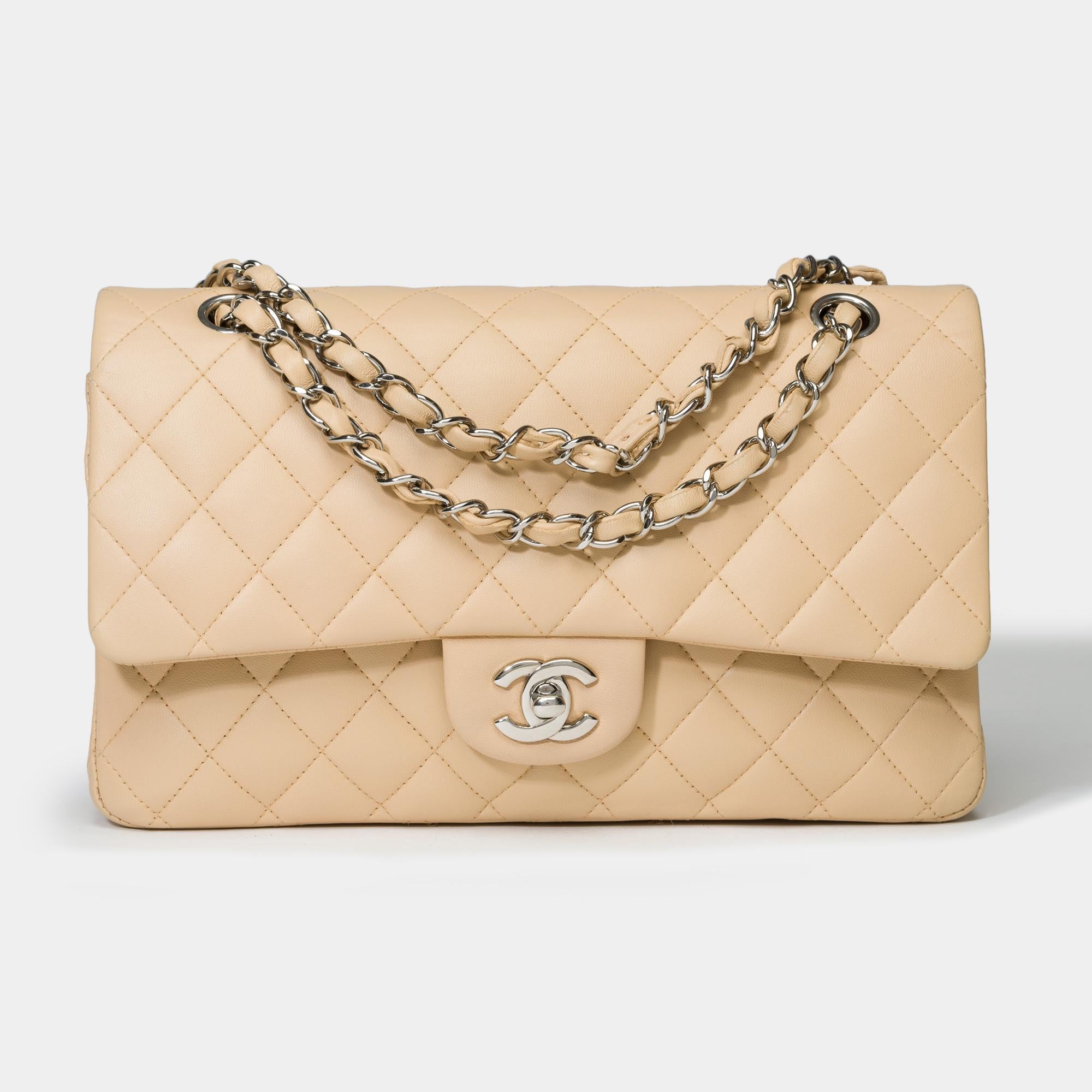 Stunning​ ​Chanel​ ​Timeless​ ​Medium​ ​25cm​ ​double​ ​flap​ ​shoulder​ ​bag​ ​in​ ​beige​ ​quilted​ ​lambskin​ ​leather,​ ​silver​ ​metal​ ​trim​ ​,​ ​a​ ​chain​ ​in​ ​silver​ ​metal​ ​interlaced​ ​with​ ​beige​ ​leather​ ​allowing​ ​a​ ​hand​