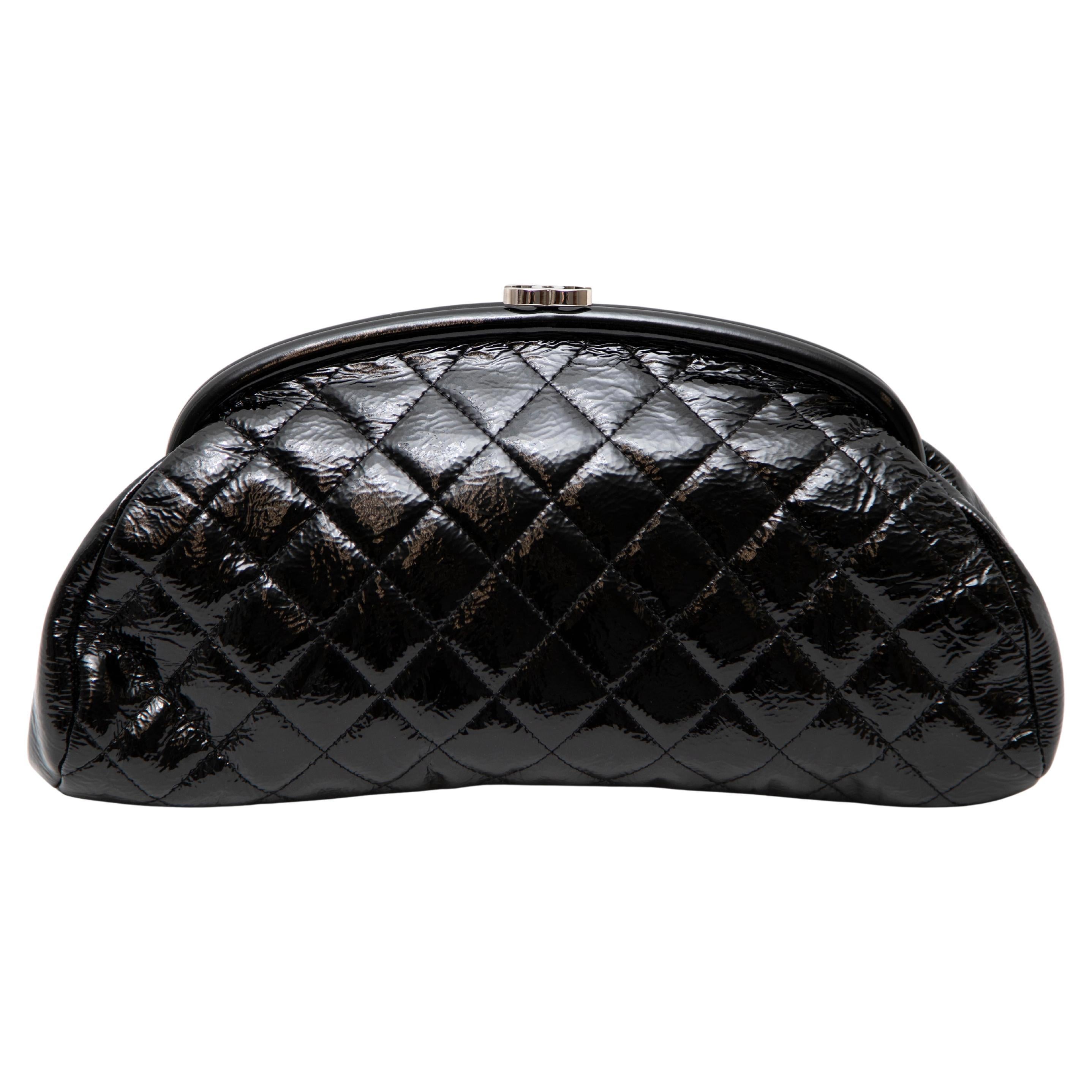 This stunning Chanel Mademoiselle Quilted Clutch Bag is crafted in black quilted leather with elegant silver-tone hardware. The timeless design features a tonal lining and a single interior zipped pocket, offering both style and practicality. As a