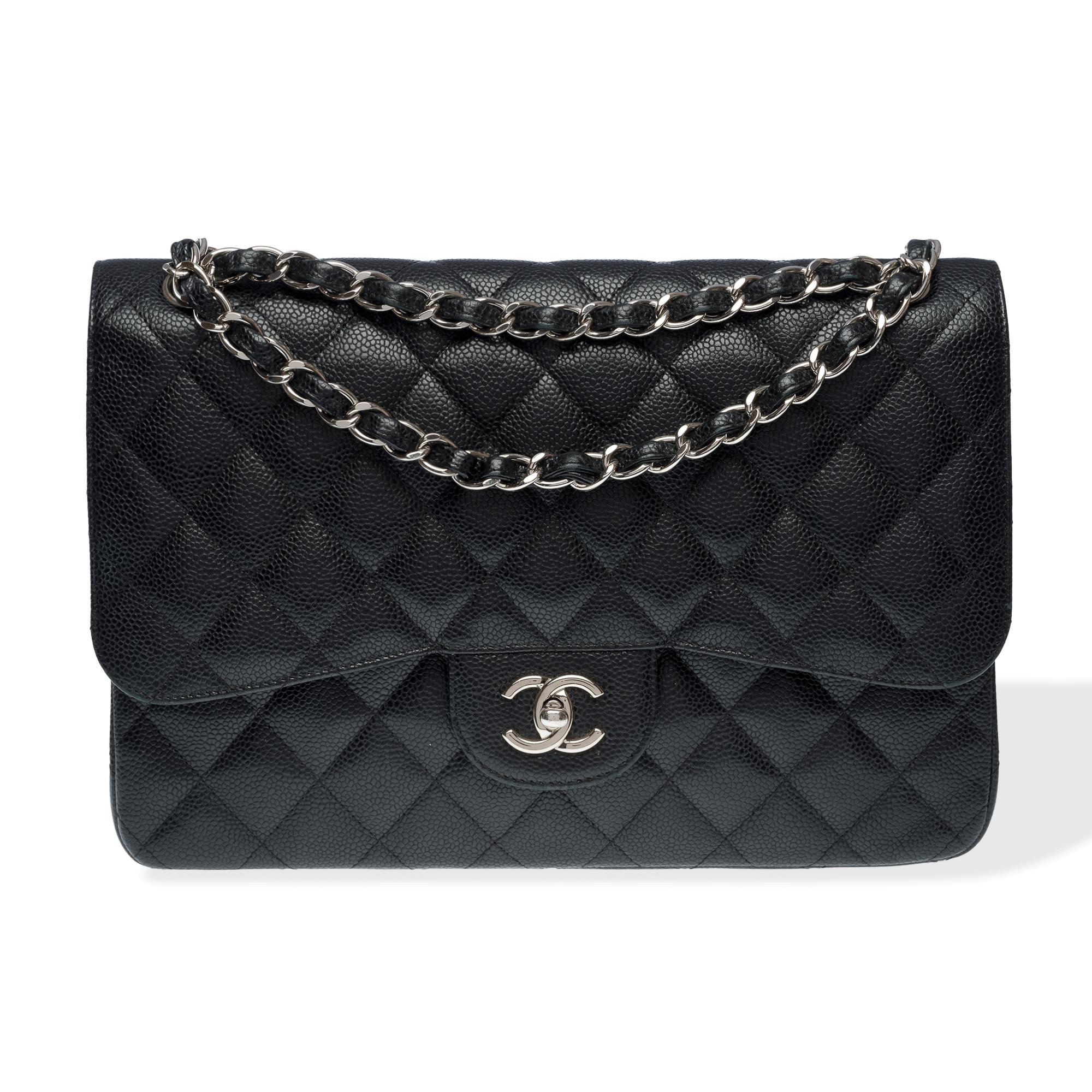 Majestic​ ​Chanel​ ​Timeless​ ​Jumbo​ ​double​ ​flap​ ​handbag​ ​in​ ​black​ ​caviar​ ​leather,​ ​silver​ ​metal​ ​trim,​ ​a​ ​silver​ ​metal​ ​intertwined​ ​chain​ ​handle​ ​with​ ​black​ ​leather​ ​for​ ​hand,​ ​shoulder,​ ​or​ ​crossbody​