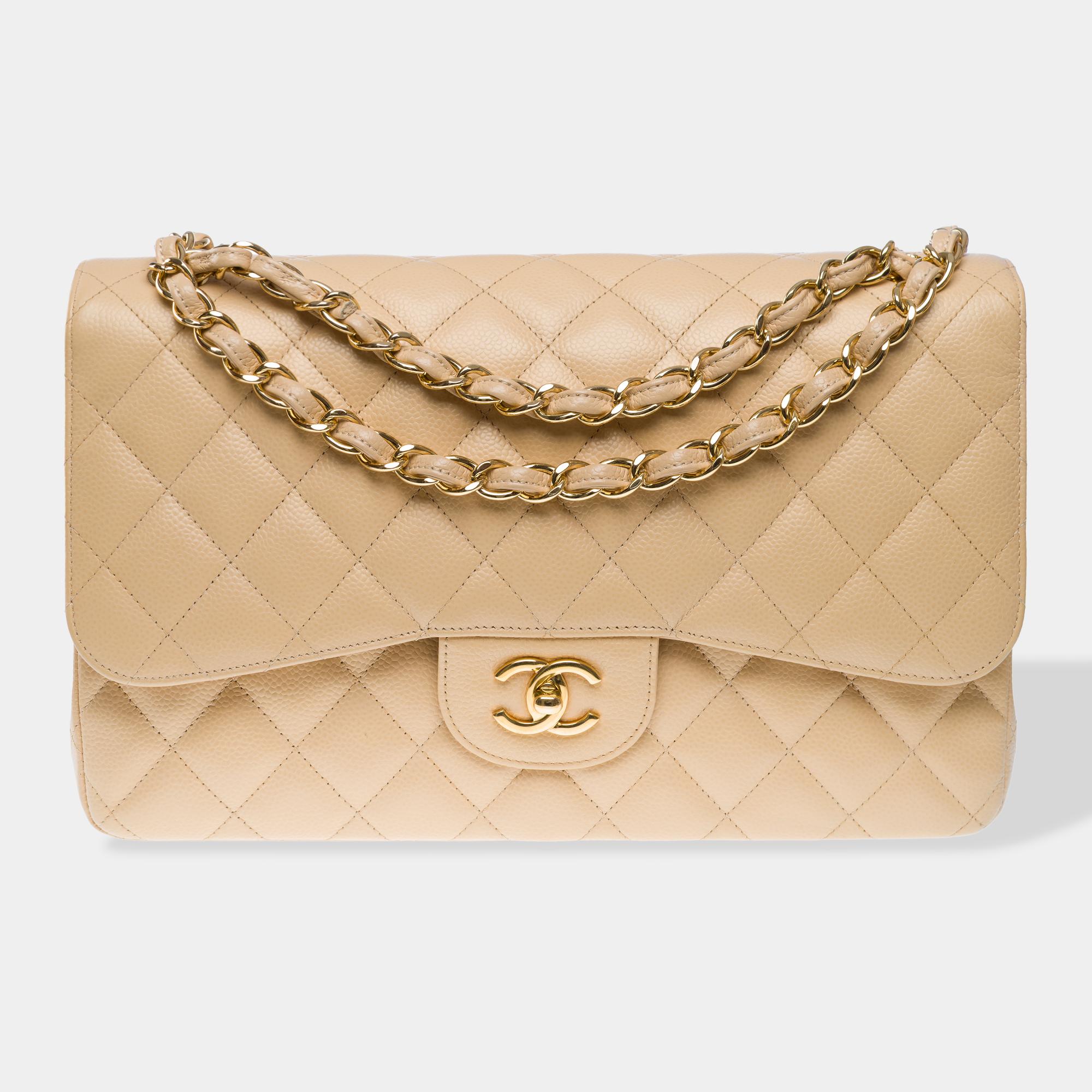 Majestic​ ​Chanel​ ​Timeless​ ​Jumbo​ ​beige​ ​caviar​ ​leather​ ​double​ ​flap​ ​shoulder​ ​bag,​ ​with​ ​gold-tone​ ​metal​ ​hardware,​ ​a​ ​gold-tone​ ​metal​ ​interlaced​ ​leather​ ​chain​ ​handle​ ​for​ ​hand,​ ​shoulder,​ ​or​ ​crossbody​