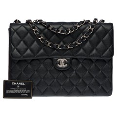 Chanel Timeless Jumbo single flap shoulder bag in black Caviar leather, SHW