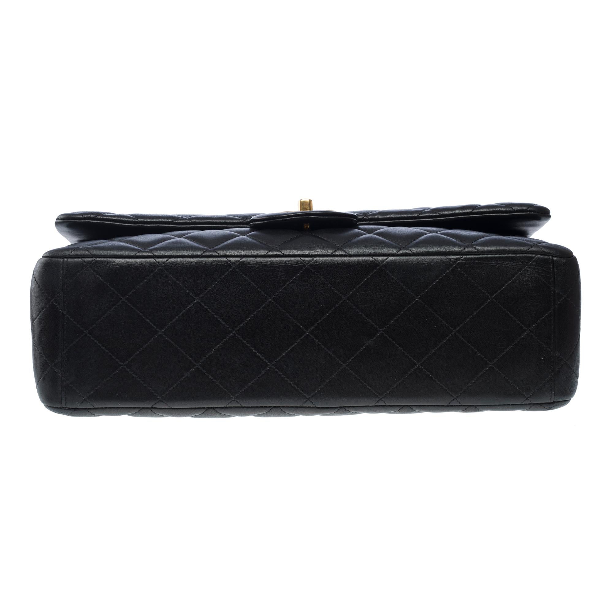 Chanel Timeless Maxi Jumbo double flap shoulder bag in Black quilted lamb, GHW For Sale 7